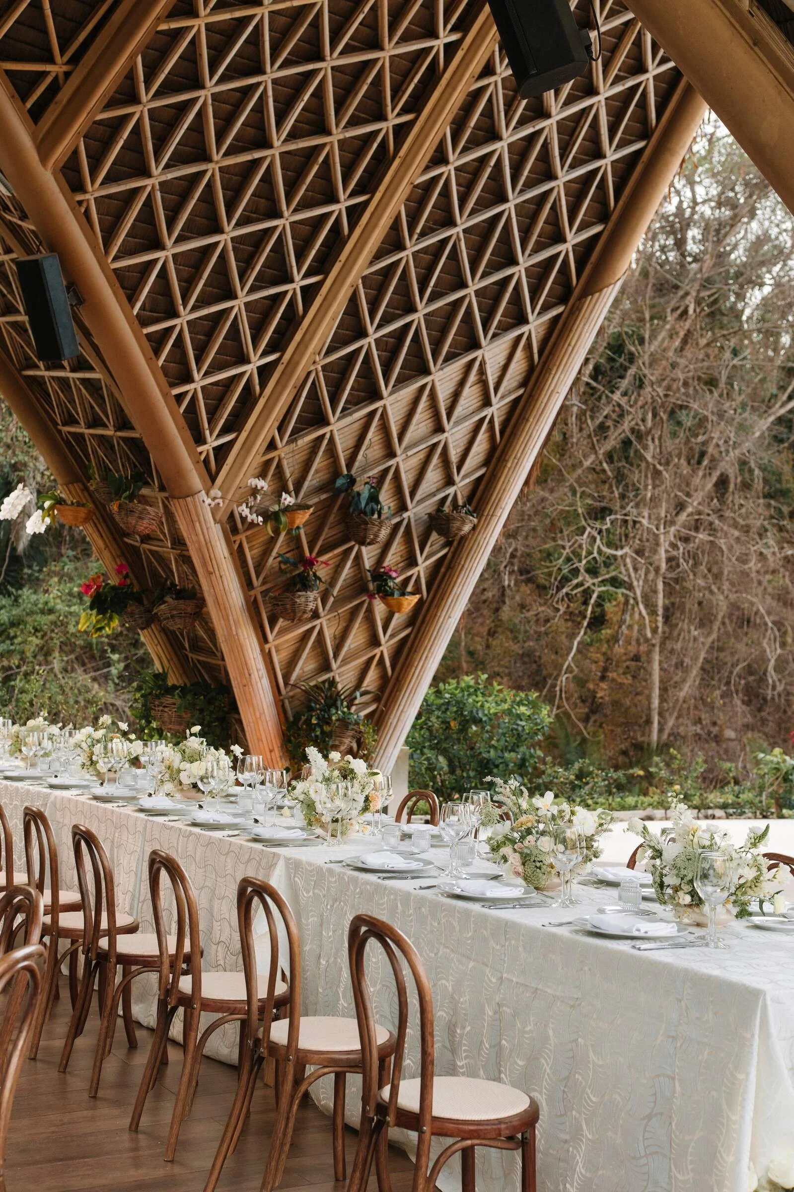 Long reception table under the bamboo architecture of The Forum at Garza Blanca