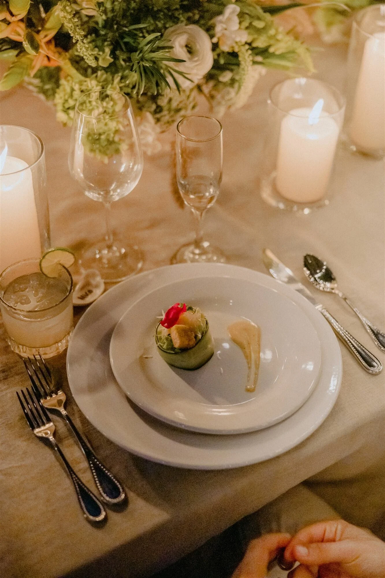 Plated dinner detail with candlelight at an intimate Puerto Vallarta wedding