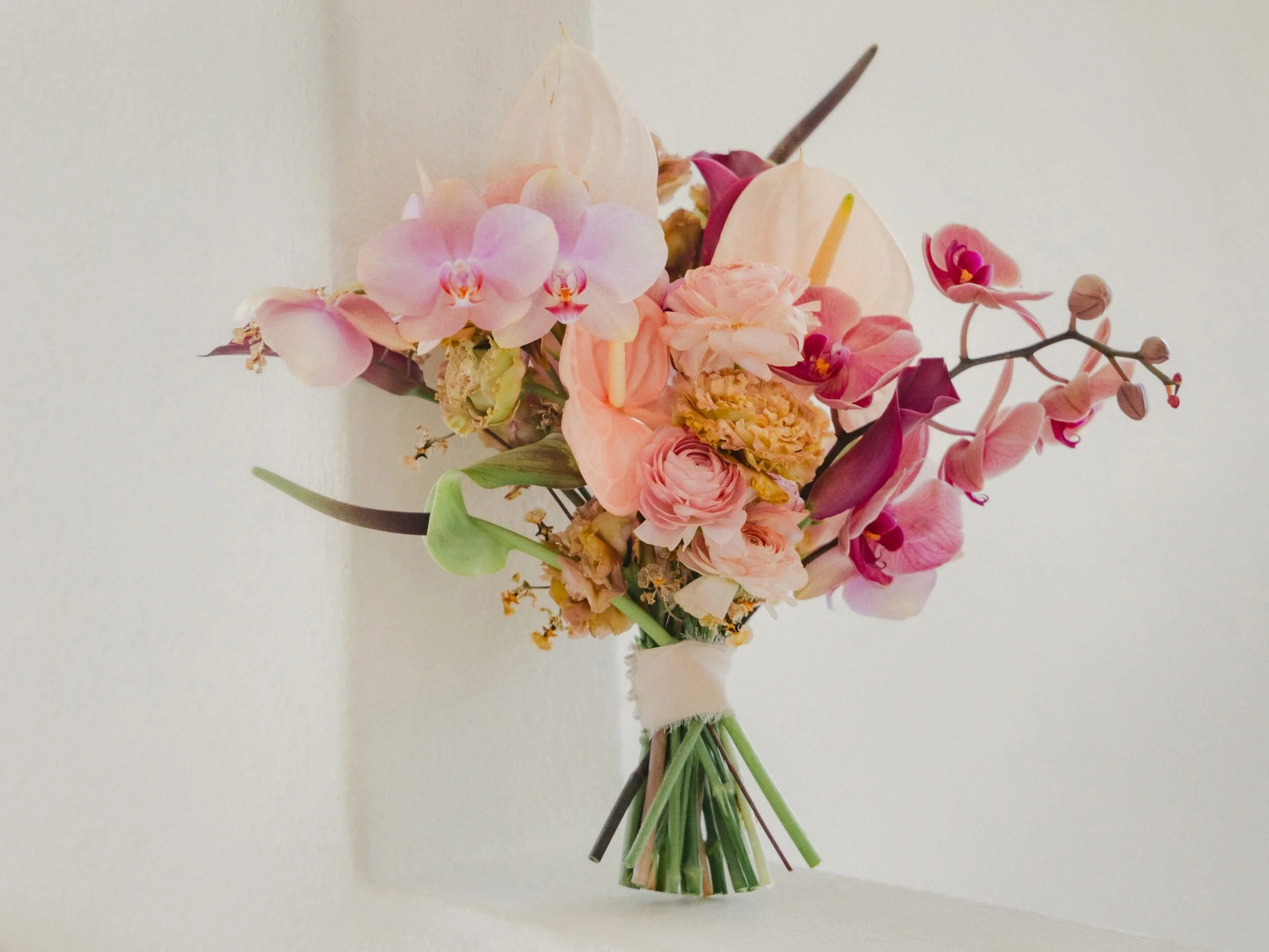 Phalaenopsis and anthuriums bridal bouquet in blush, mauve and cream