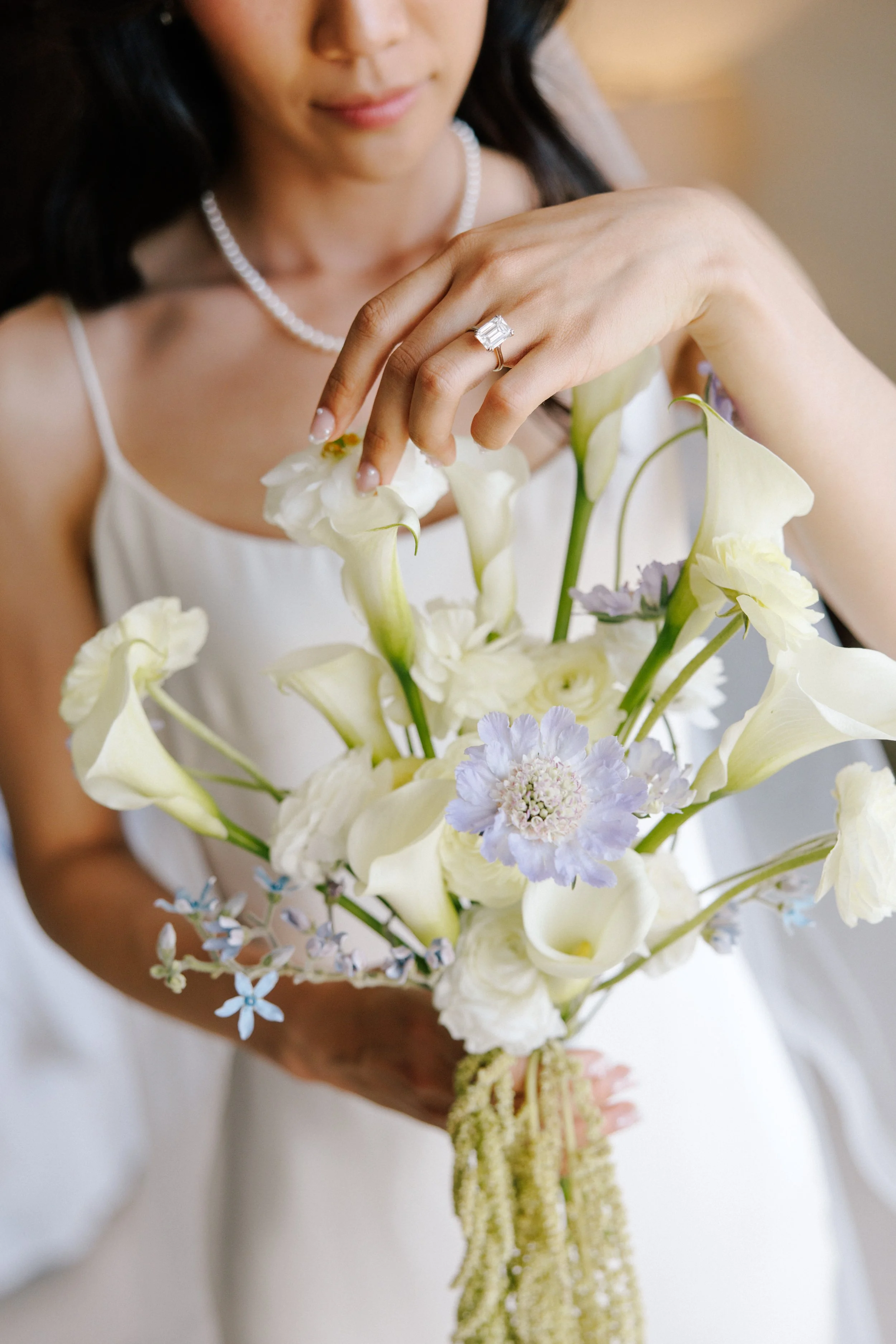 Bridal bouquet of white calla, scabiosa and trailing amaranthus at Grand Miramar