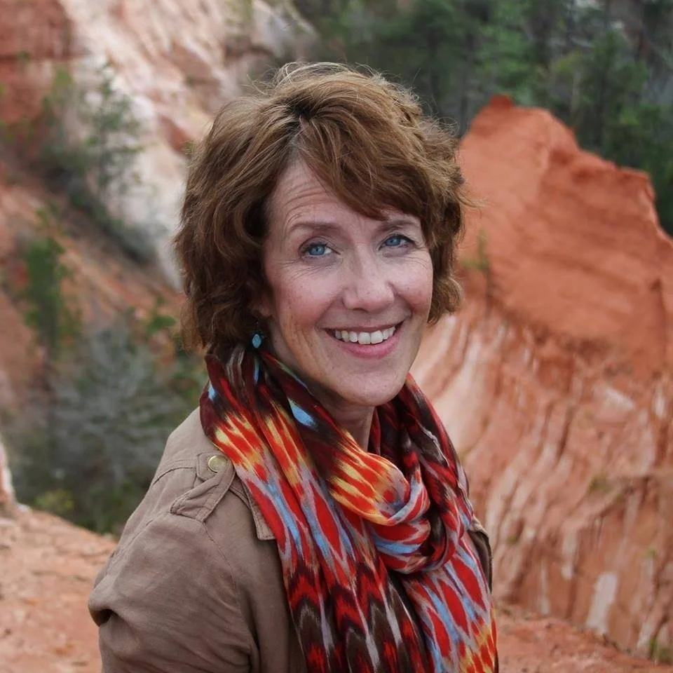 Ann Litrel standing in front of red mountains.