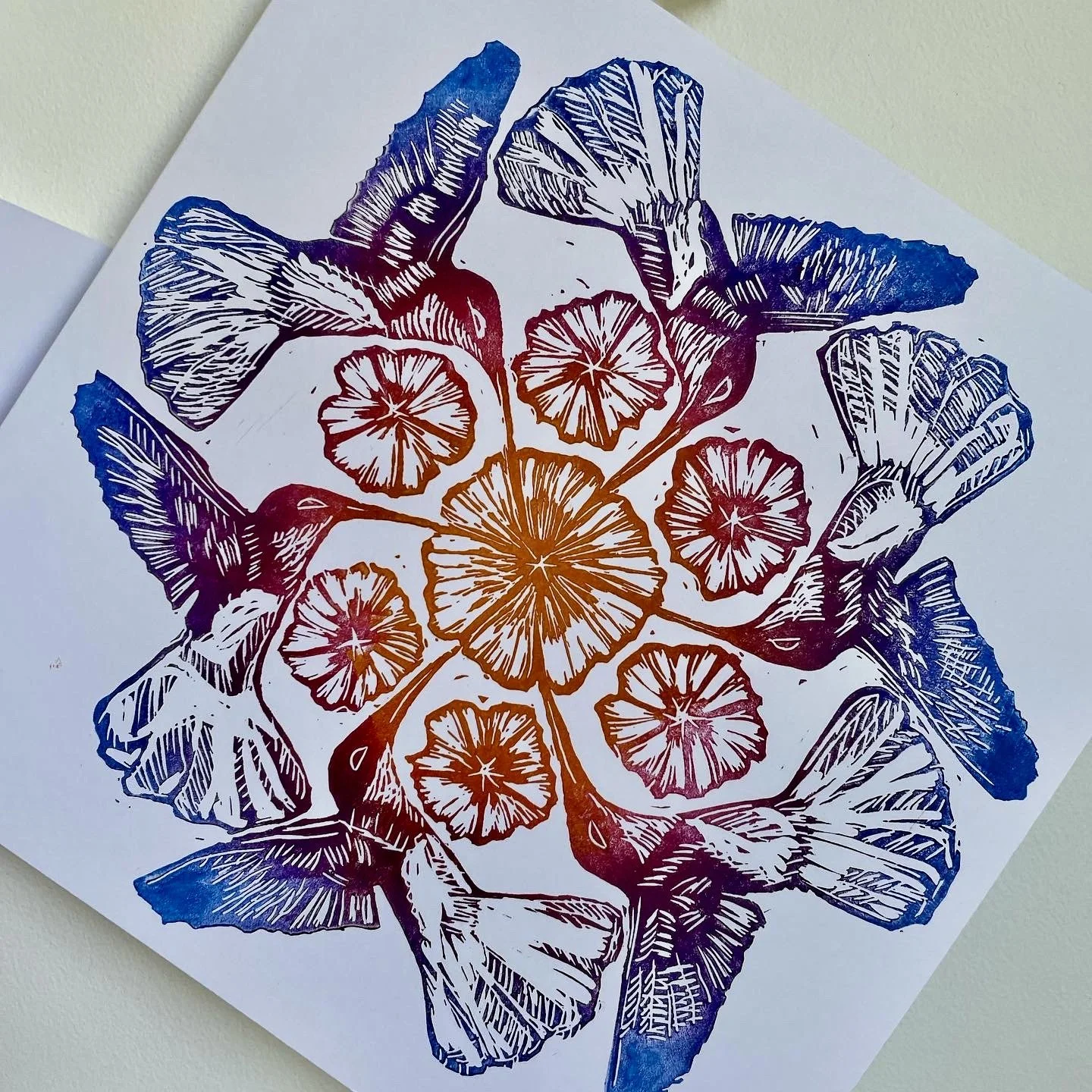 Colorful botanical illustration on white paper featuring leaves and citrus slices in a symmetrical pattern.