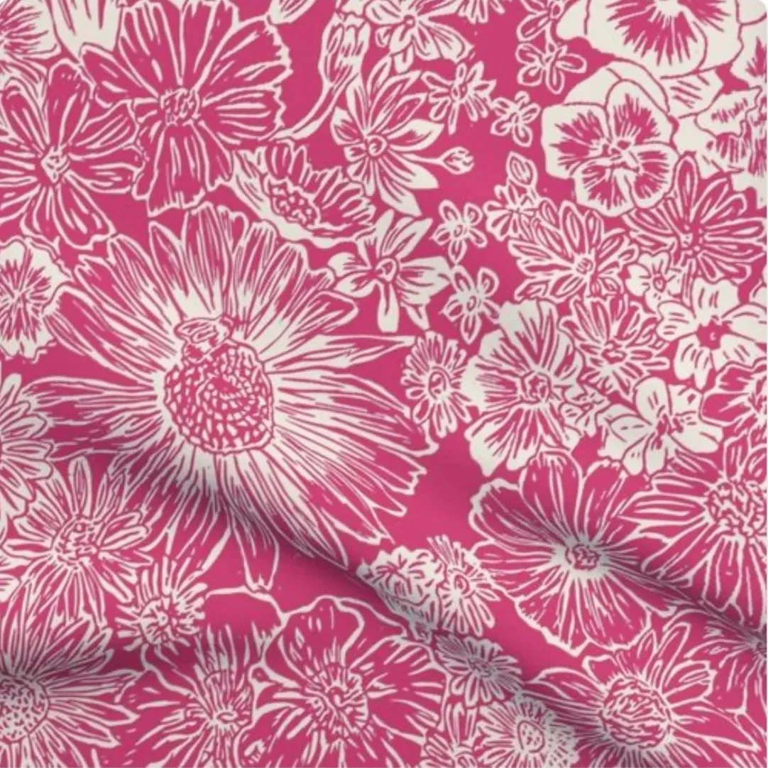 Pink floral fabric pattern with white outlined flowers and leaves.
