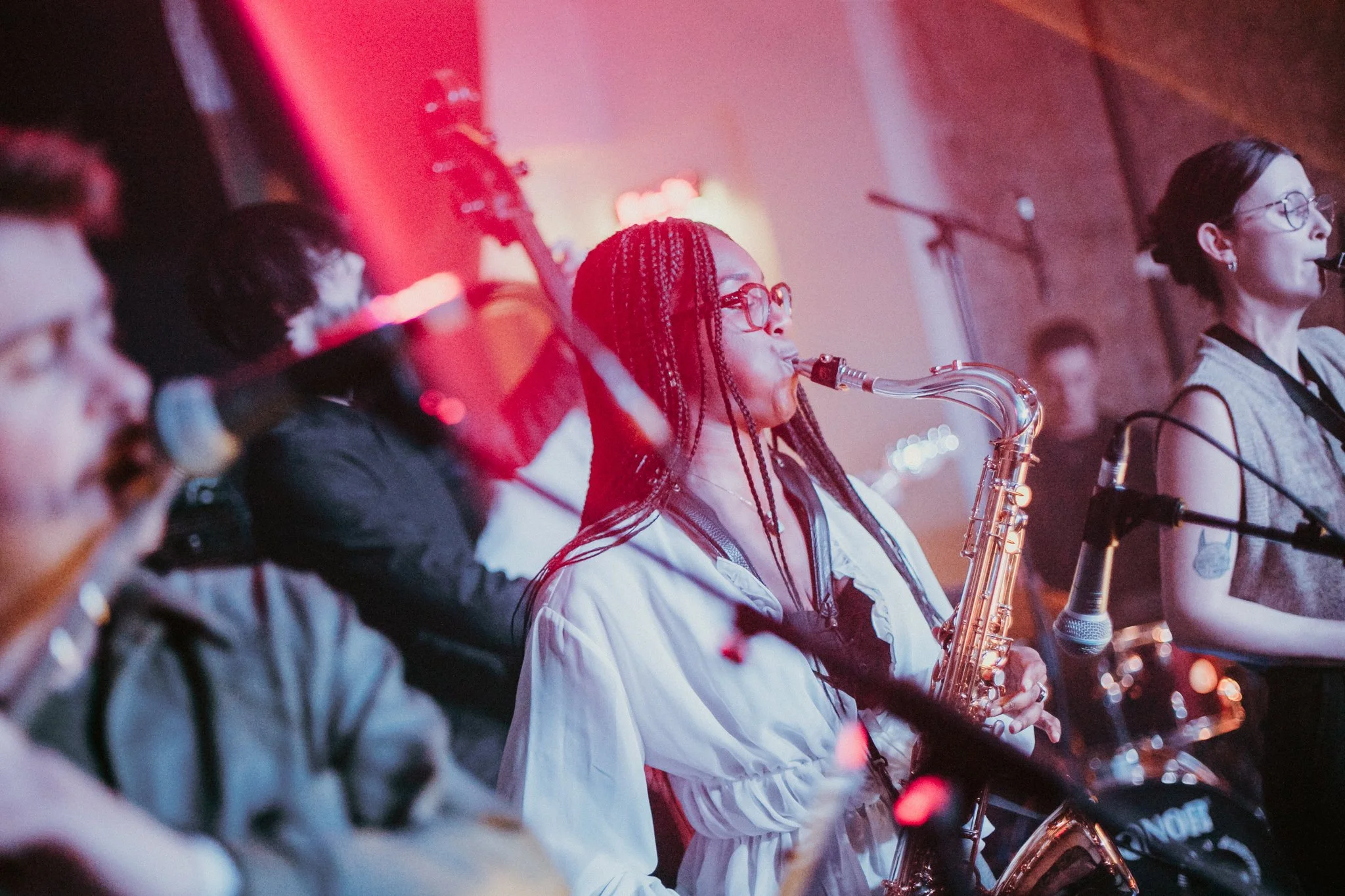 Live jazz band performance with saxophonist and musicians