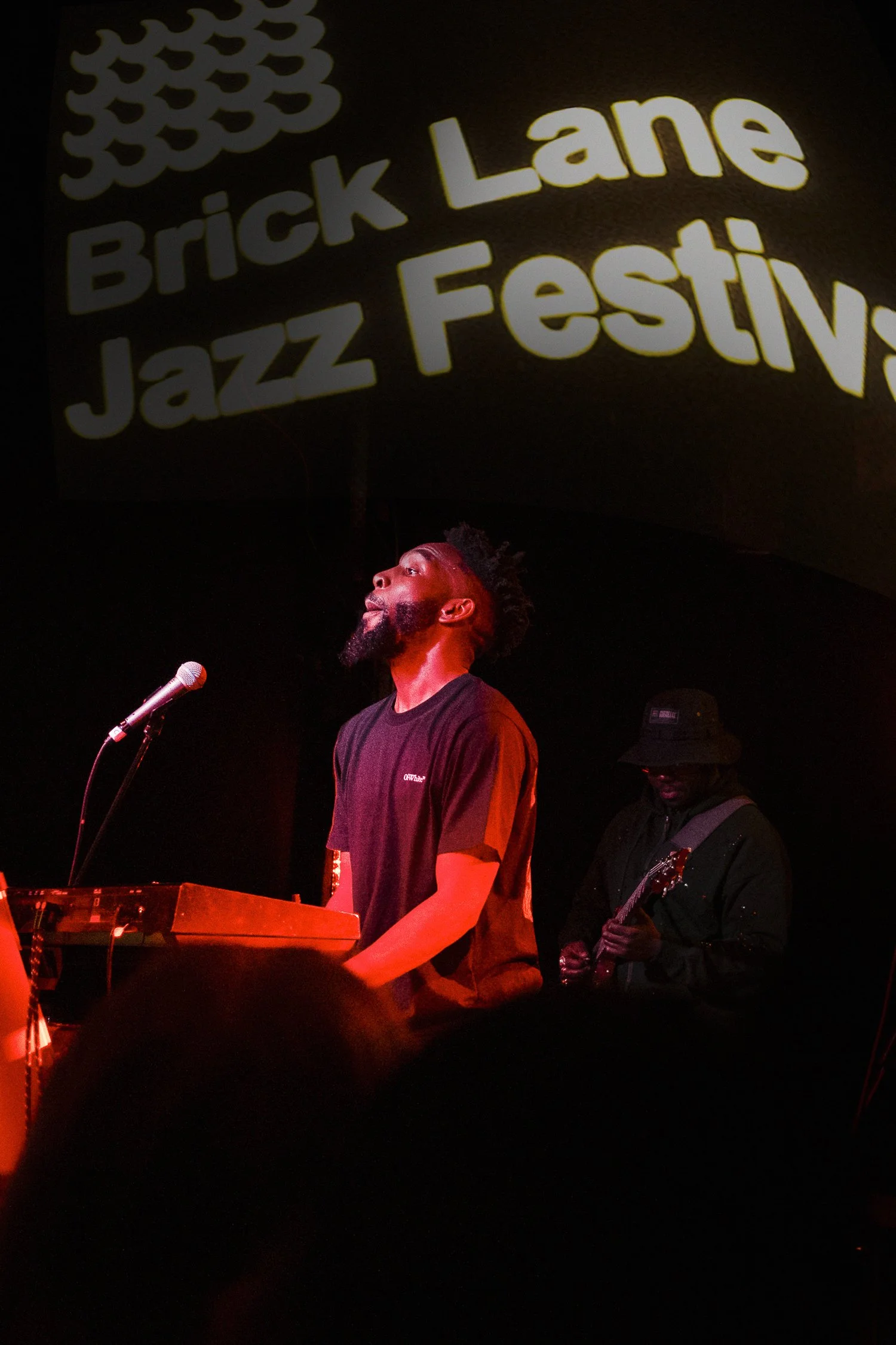 Musicians performing at Brick Lane Jazz Festival with keyboard and guitarist.