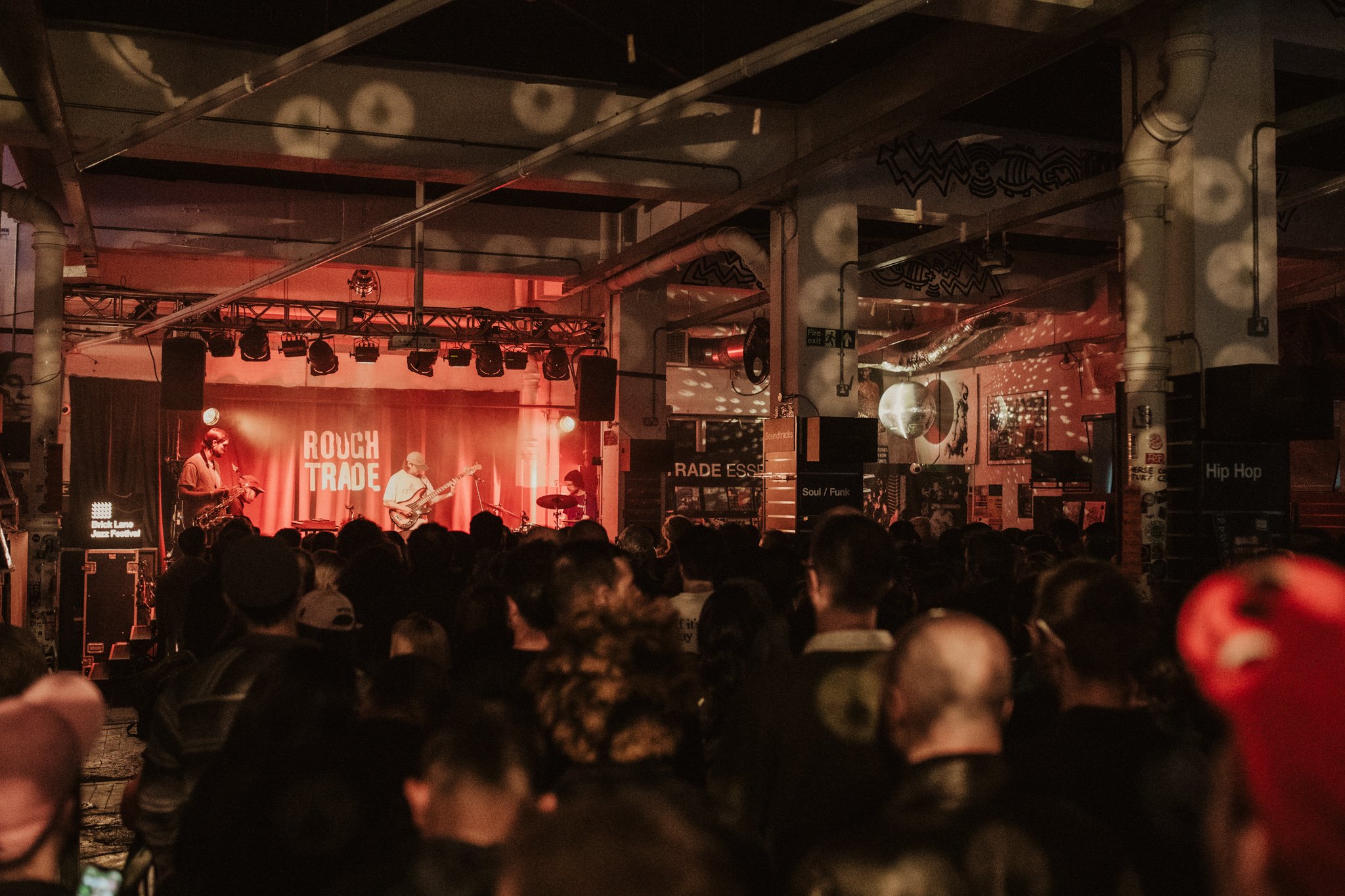 Indoor concert at Rough Trade with audience watching musicians on stage