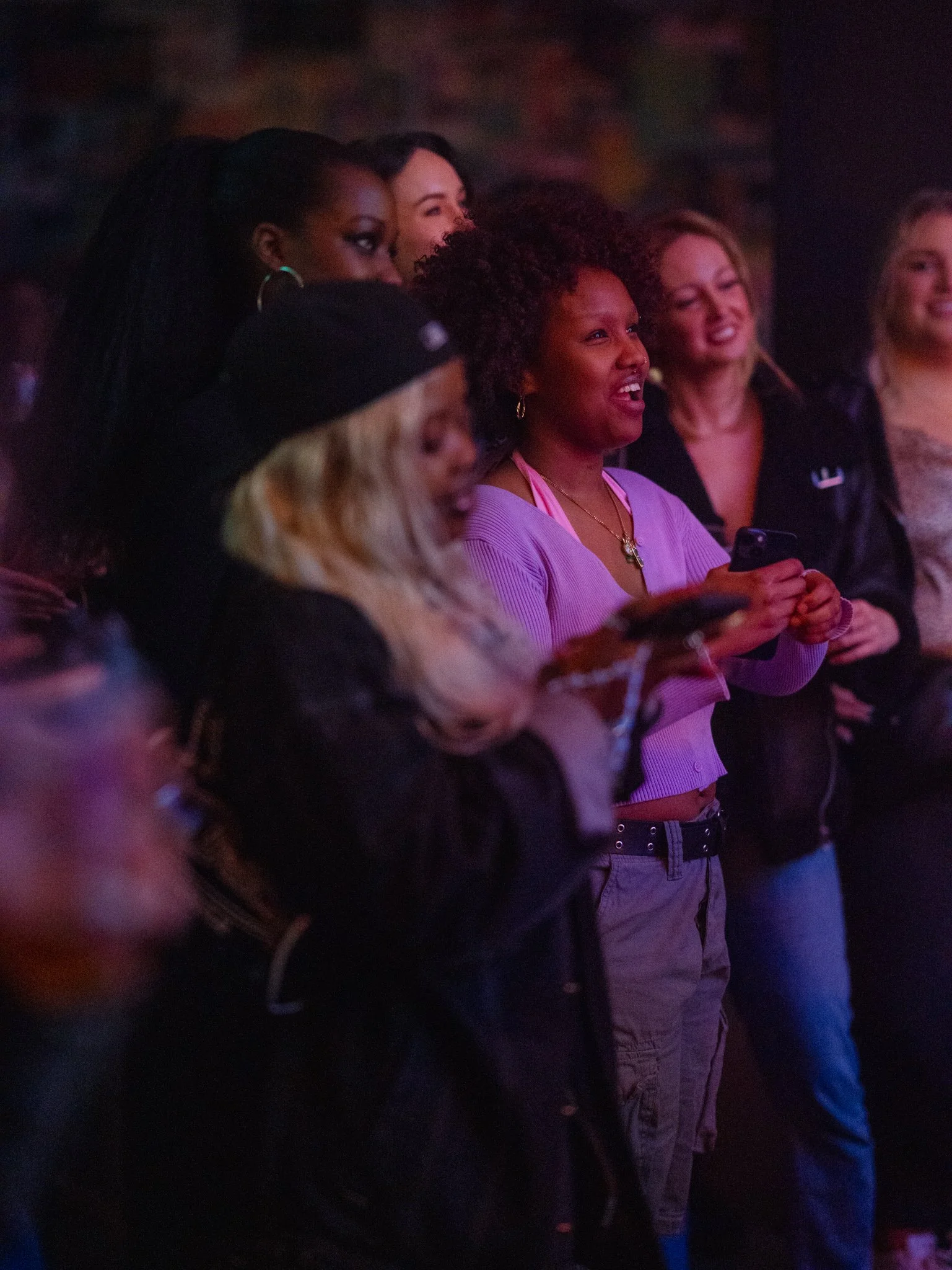 A group of people enjoying a live event indoors.