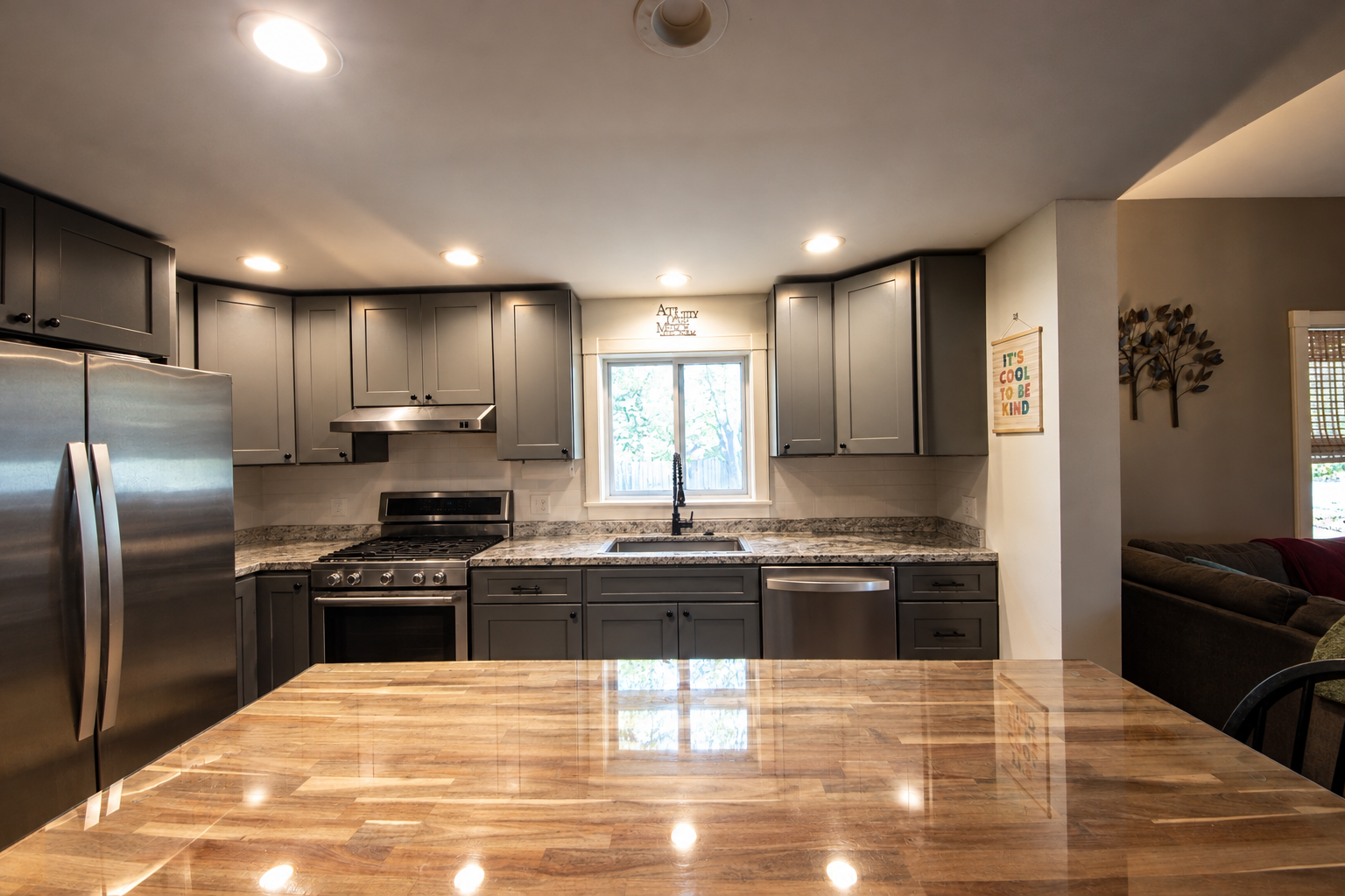 Clean Modern Kitchen with Warm Reflections.png