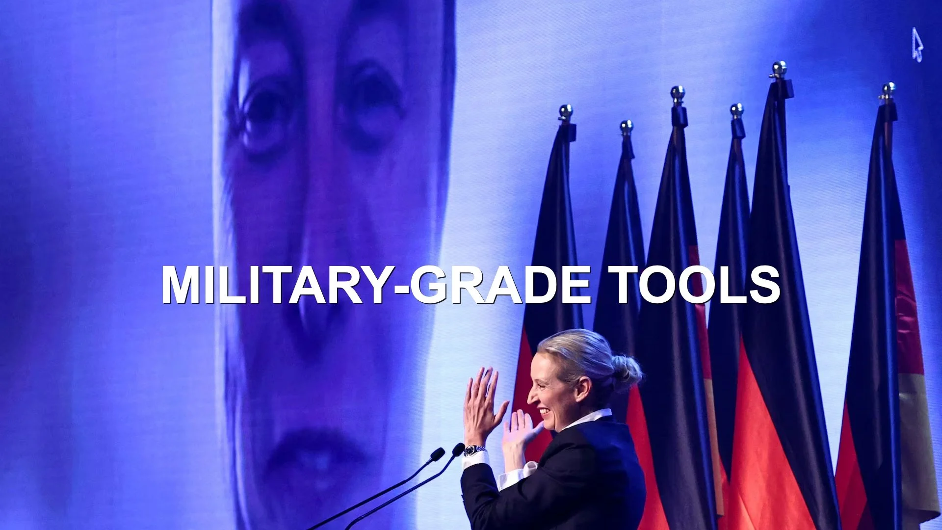 Words: MILITARY-GRADE TOOLS in white capitals, over an image of a female politician in front of flags, Behind her, Nigel Farage's face appears on a giant screen, like Big Brother