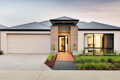 Residential house cleaning in Fort Lauderdale Modern single-story house with a gray roof, brick accents around the entrance, large windows, and a landscaped front yard.
