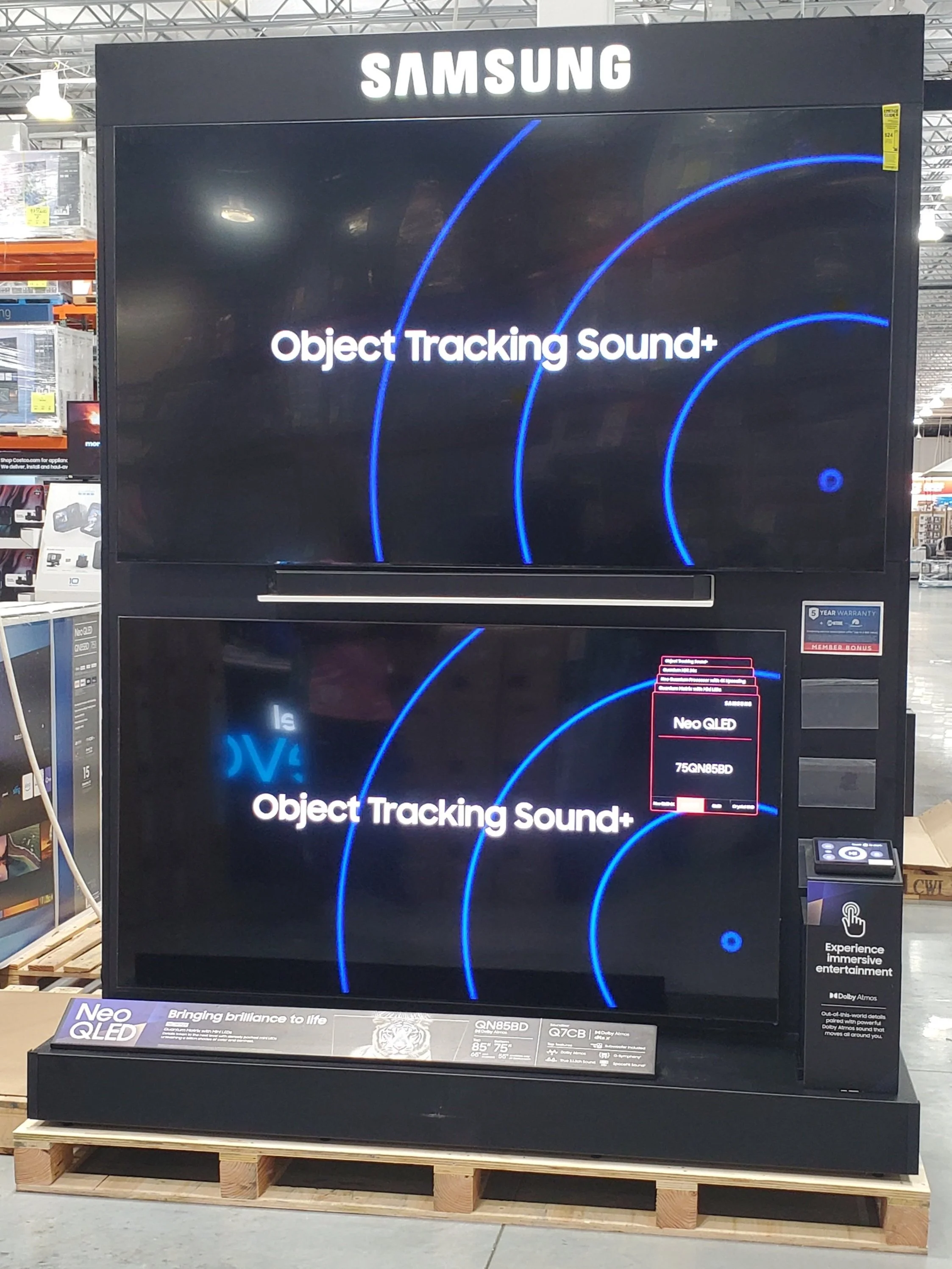 Installation Service  West Palm Beach, Boca Raton, Delray Beach, Boynton Beach Large Samsung Neo QLED television on display in a store, showcasing object tracking sound and immersive entertainment features.