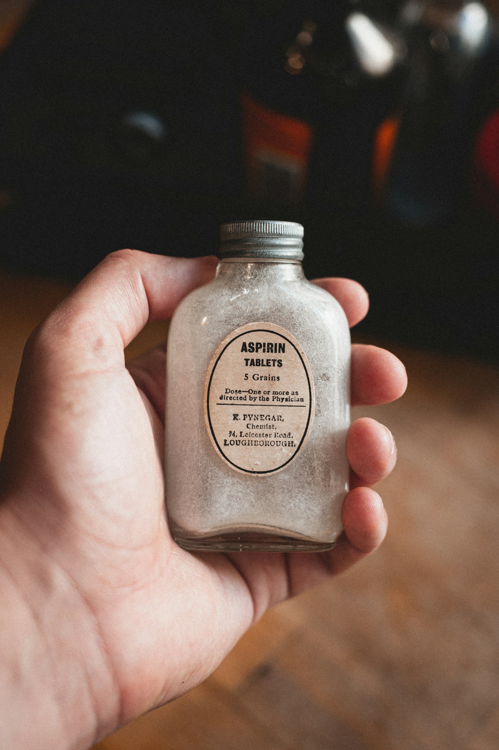 Bottle of aspirin representing salicylate ingredients used in some topical pain relief products.
