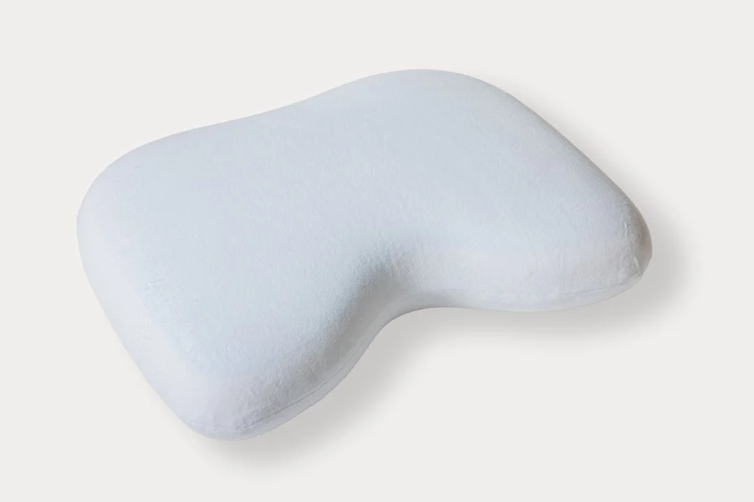 MedCline Side Sleeping Pillow shown on a bed