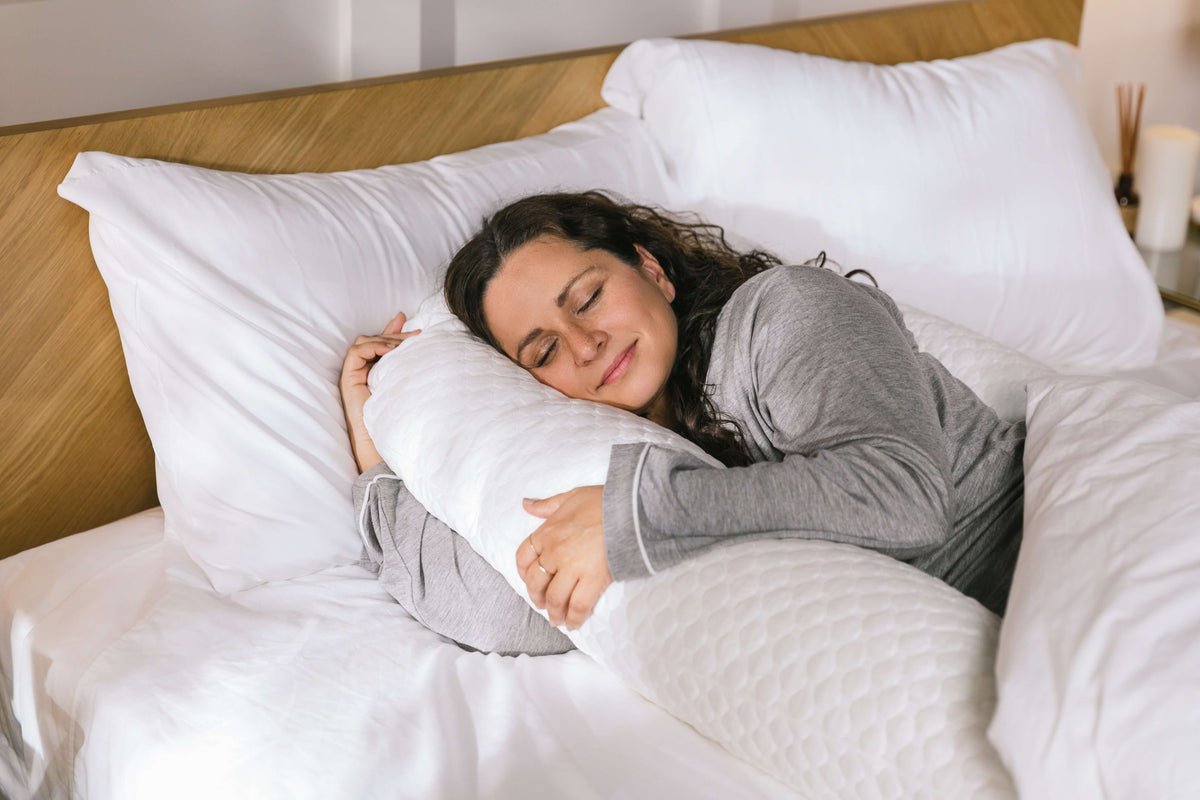 Person resting on their side with a MedCline Cooling Body Pillow