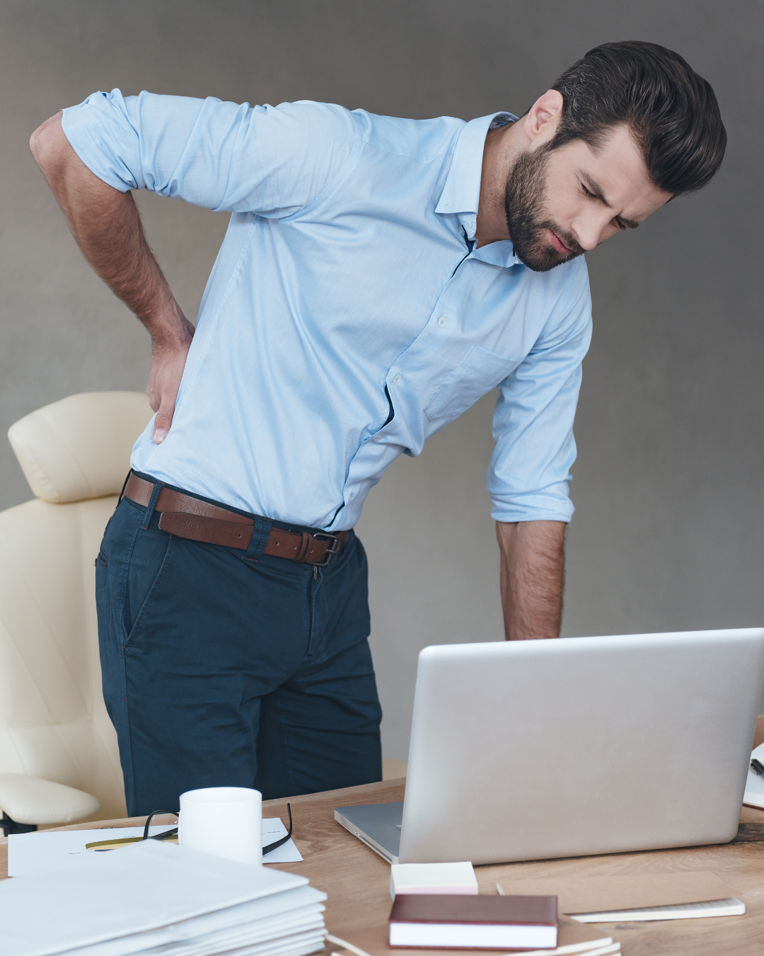 Desk worker experiencing low back and hip tightness after sitting at a computer all day