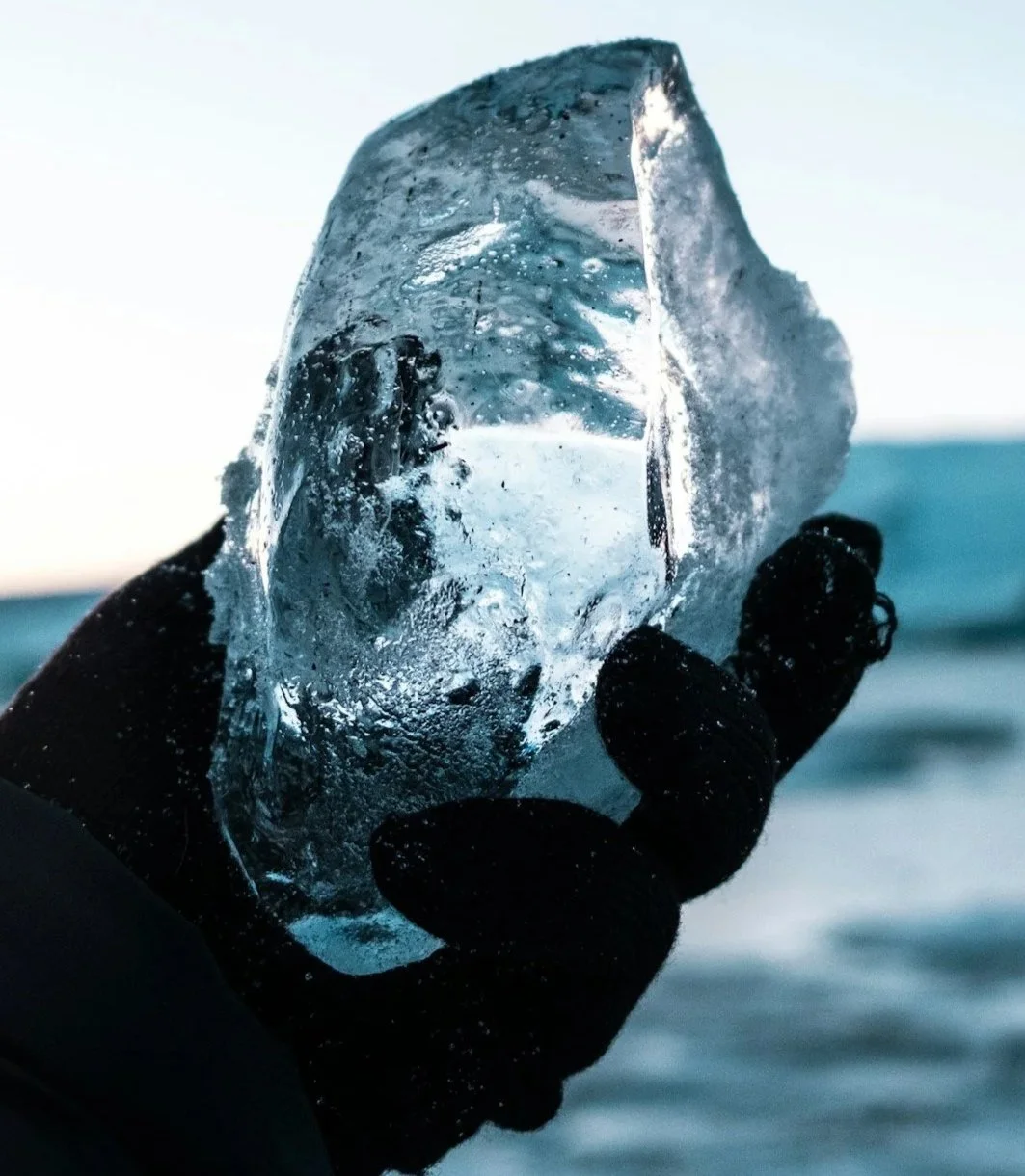 Ice sphere representing cryotherapy cold therapy used to support muscle recovery and reduce inflammation during massage therapy