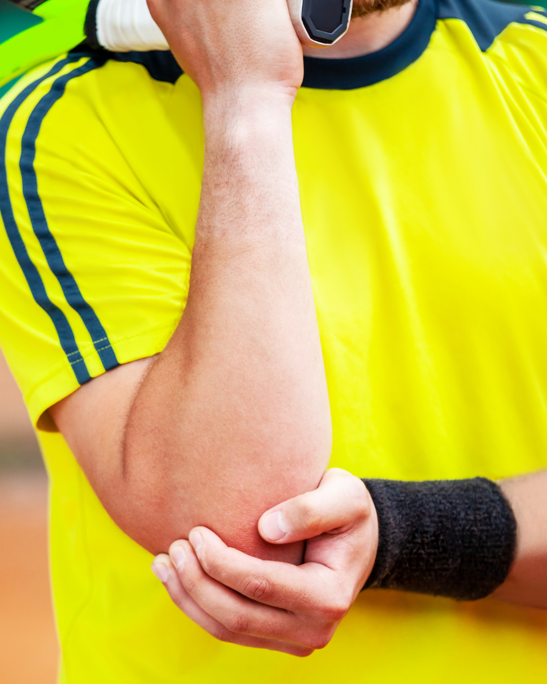 Athlete holding a painful elbow after repetitive gripping and arm activity.