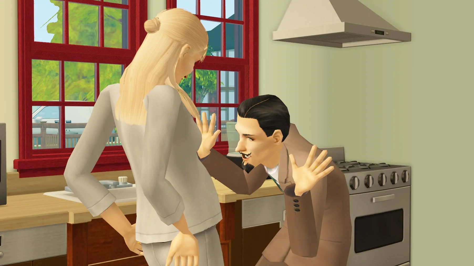 Cornwall Capp talking to the tummy of his pregnant wife Regan Capp