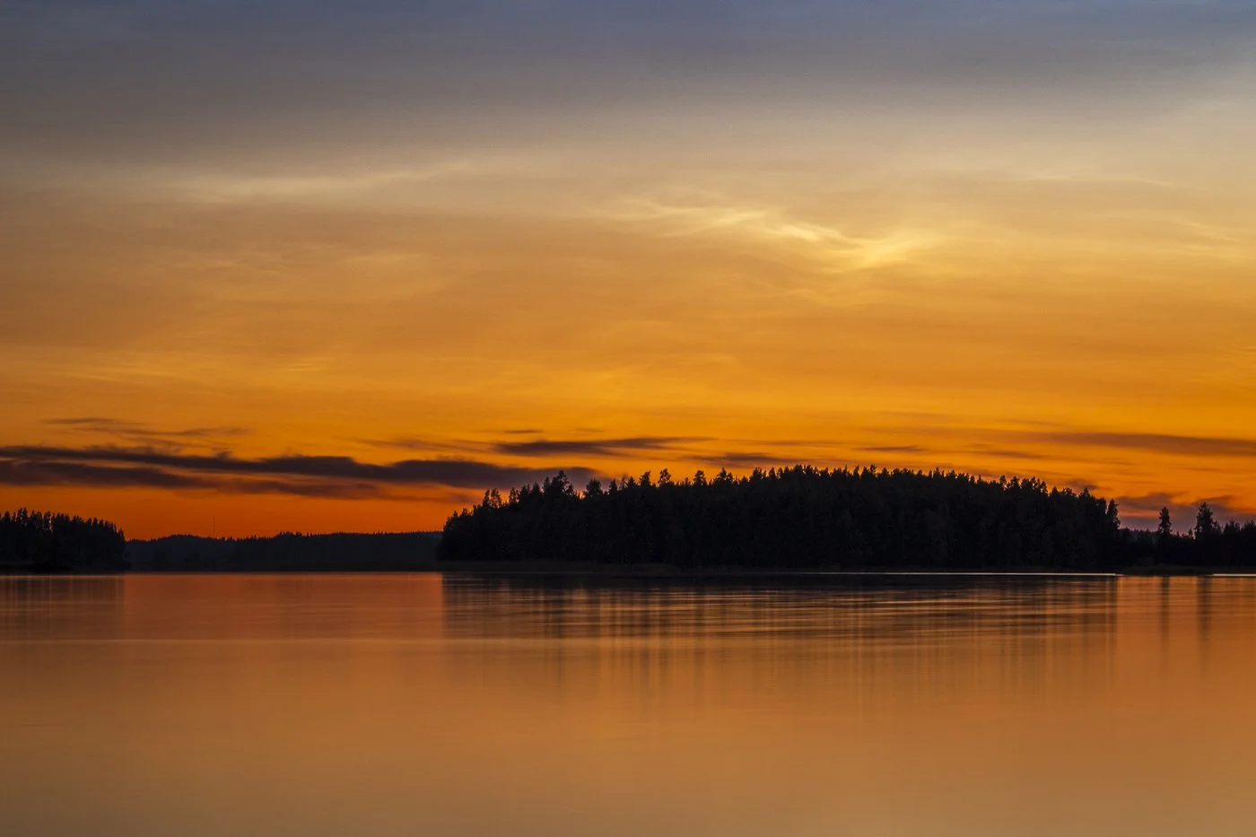Noctilucent clouds visible above Saimaa with lingering sunset colours