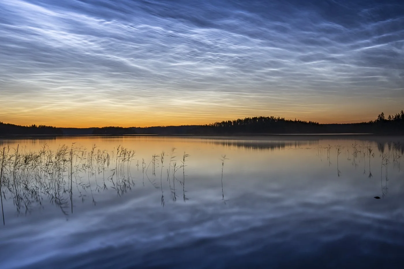 Noctilucent clouds above the islands of Lake Saimaa during a July summer night