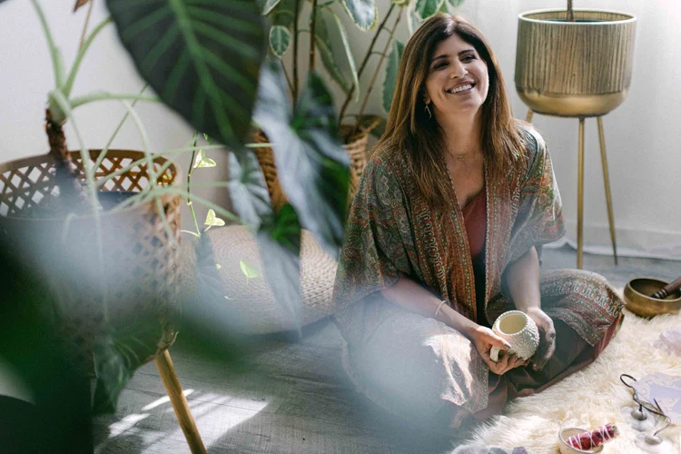Jennifer seated in a private Highest Source Healing session space