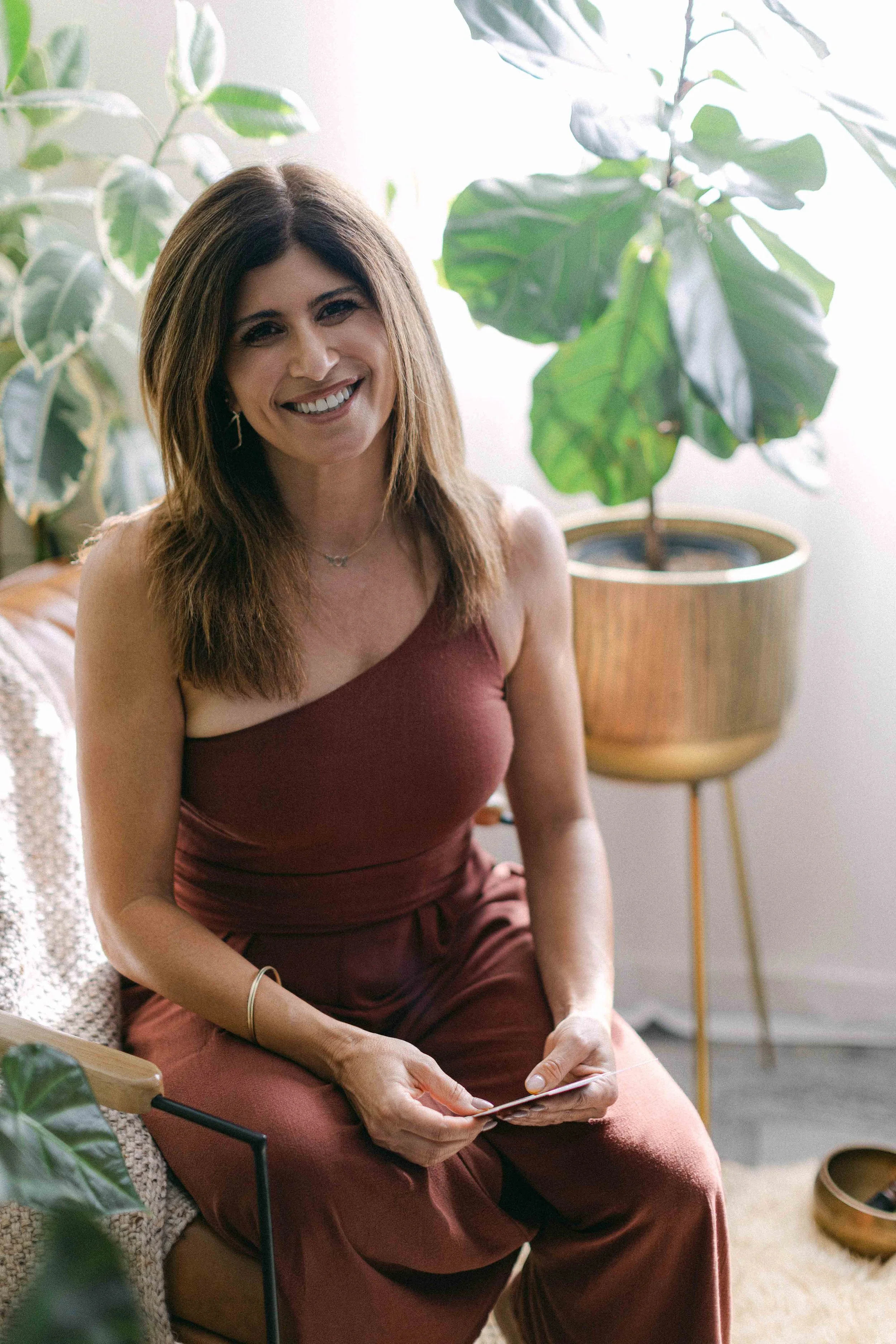 Jennifer smiling before a private Reiki session in Orange County