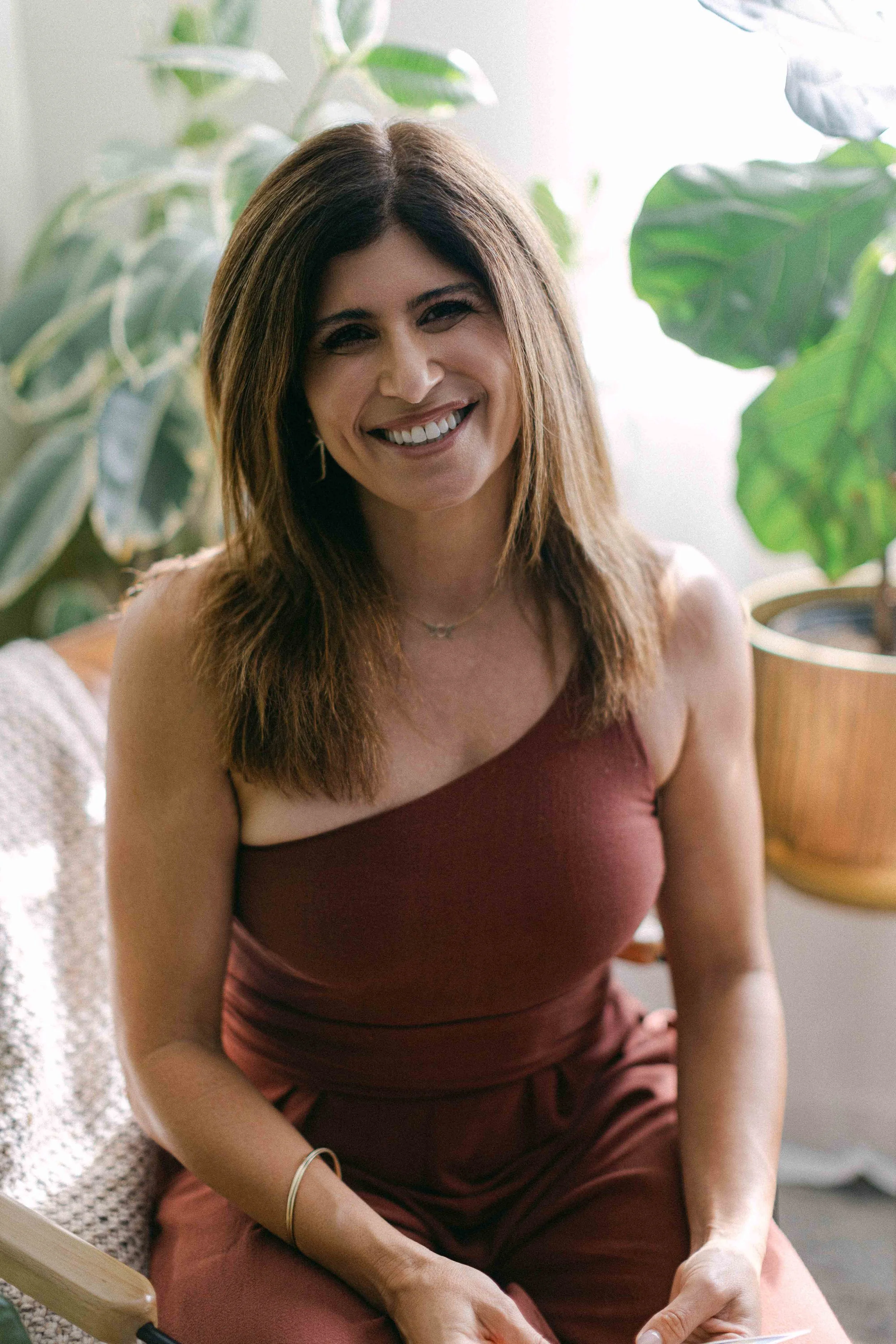 Portrait of Jennifer, founder of Highest Source Healing, in her Orange County wellness space.