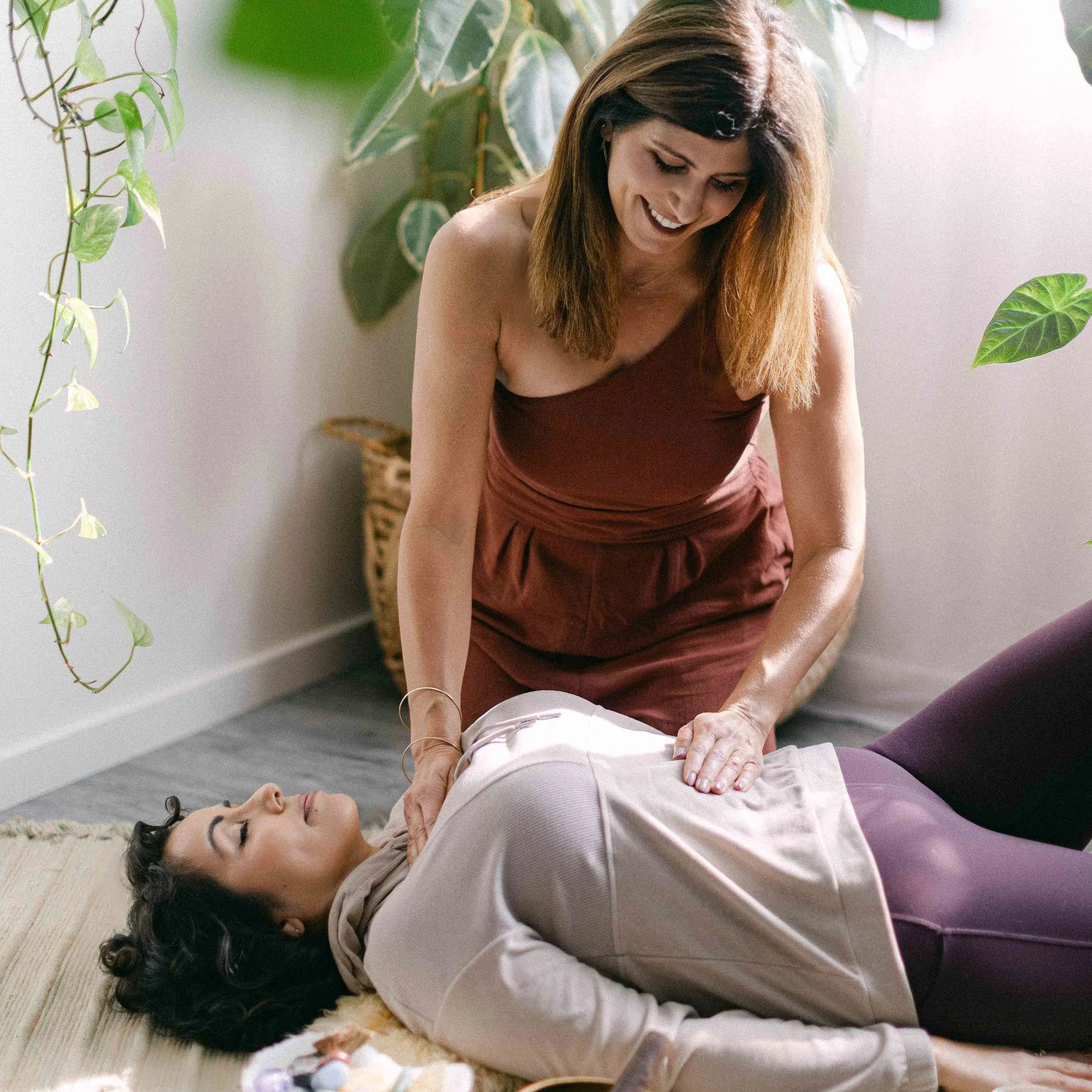 Jennifer demonstrating breathwork and Reiki healing in her certification training.