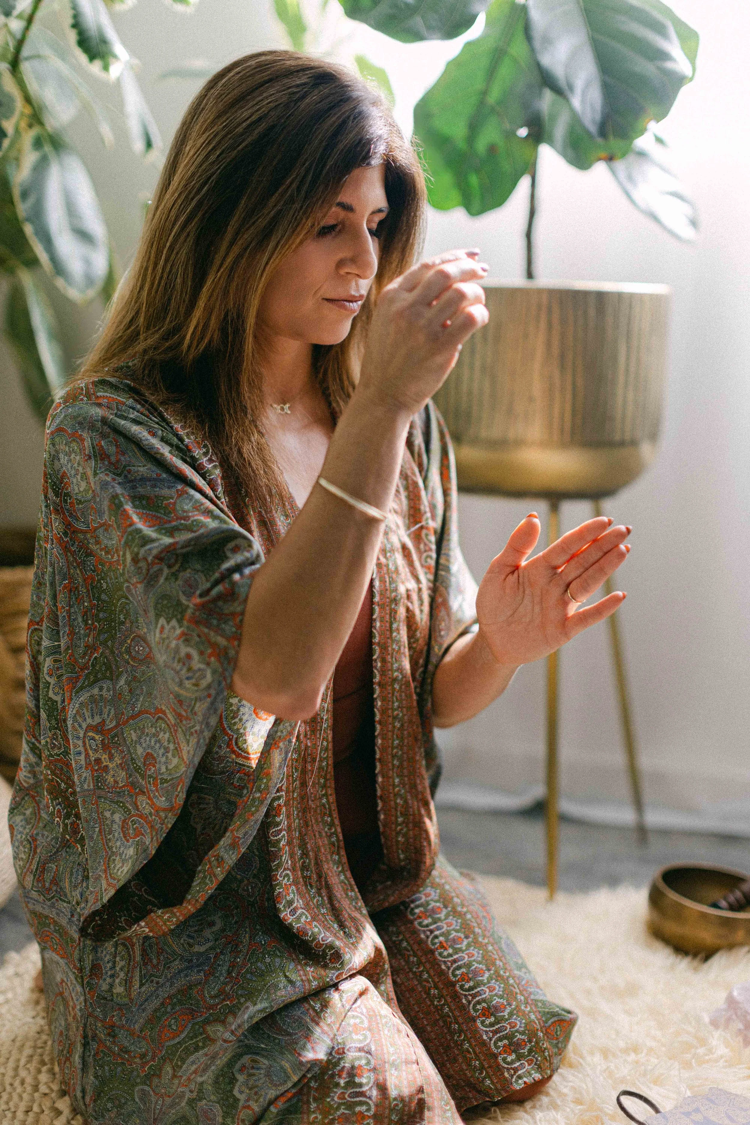 Jennifer in a meditative breathwork pose during a Threshold Series retreat