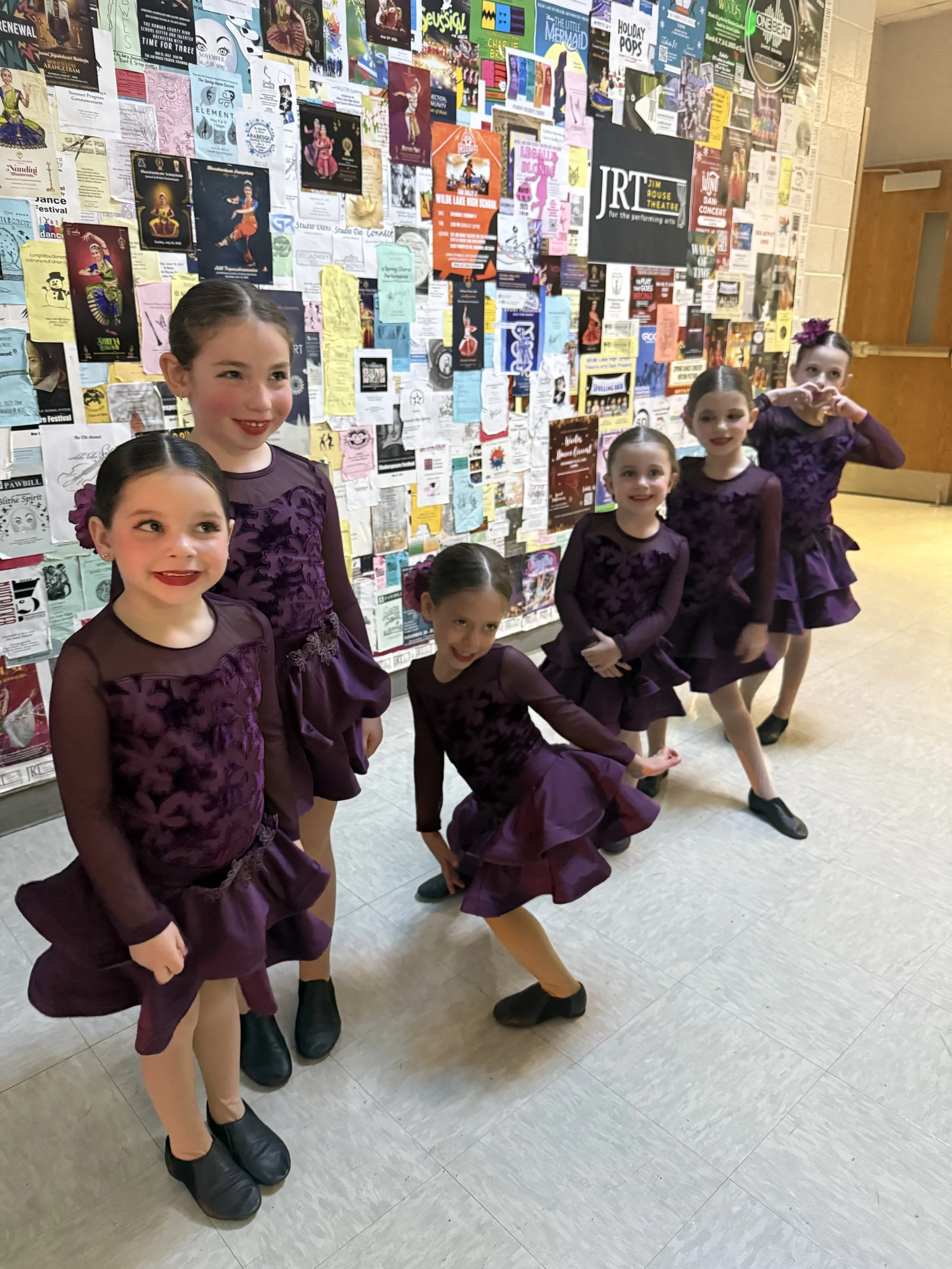 Backstage Dance Studio dancers waiting in the hallway before taking the stage at the annual dance recital.
