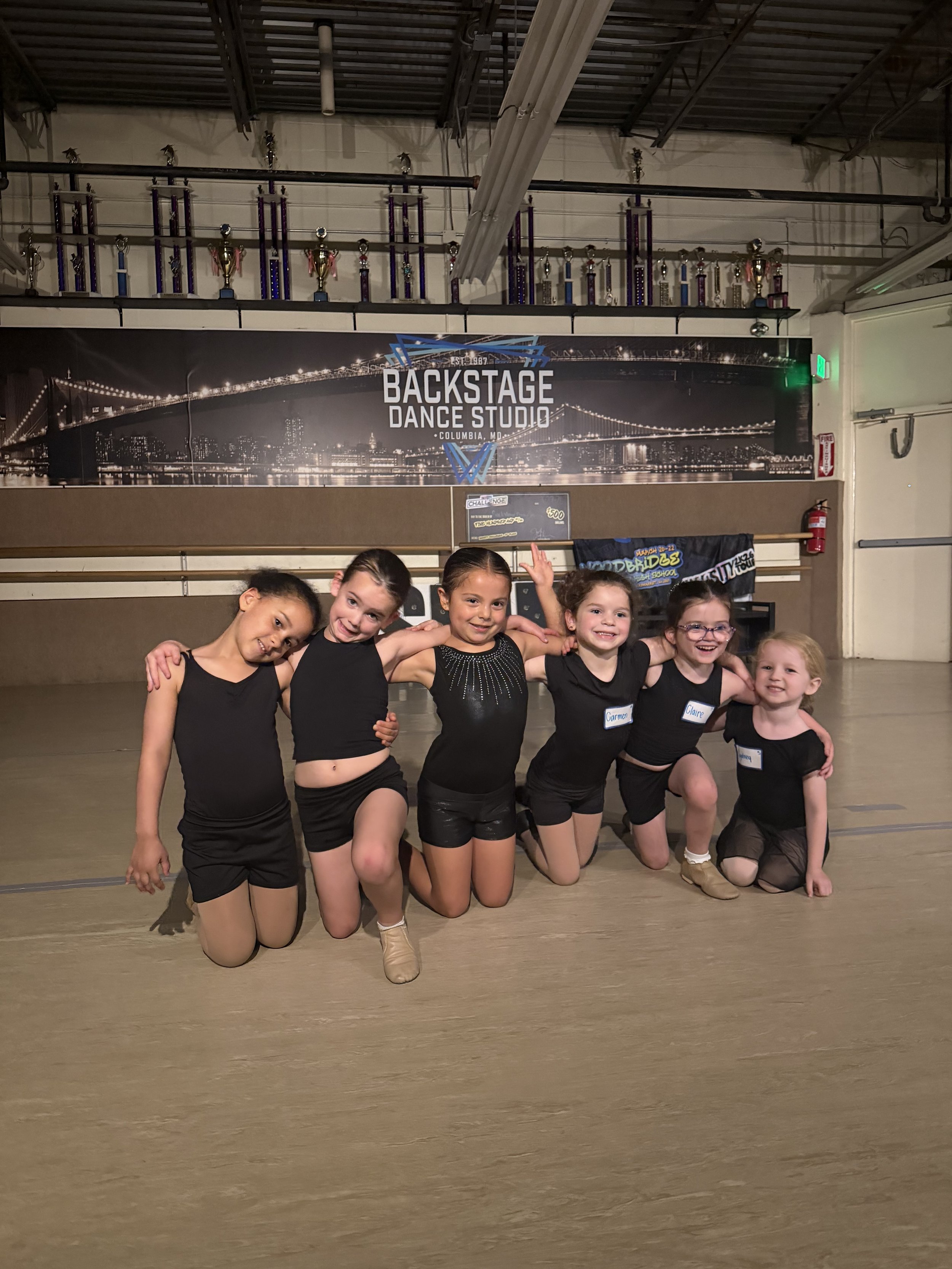 Backstage Dance Studio’s youngest competitive dancers smiling together at Show Troupe auditions.
