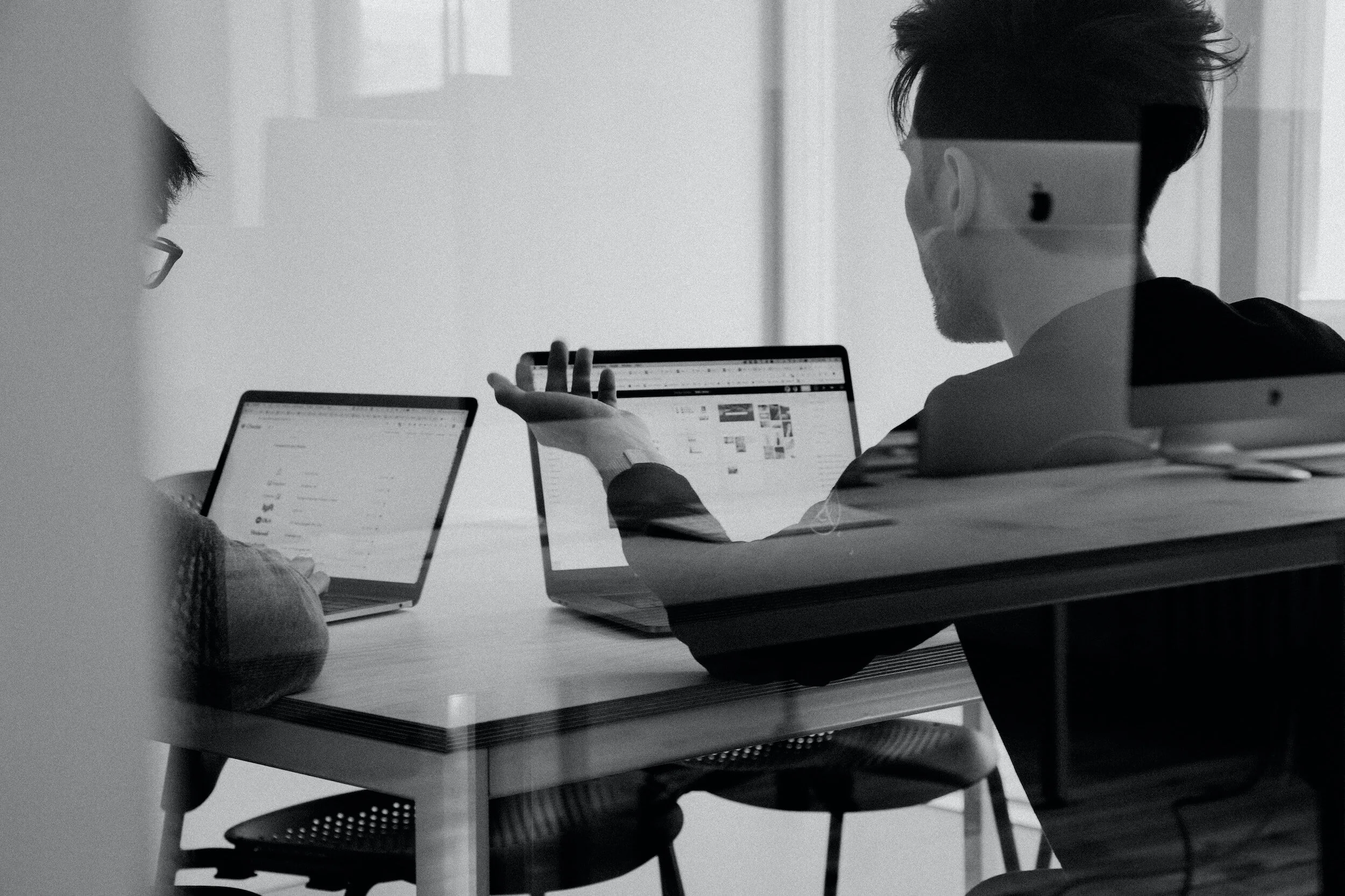 Man looking at computer screen. Representing someone looking for google ads for counselors.