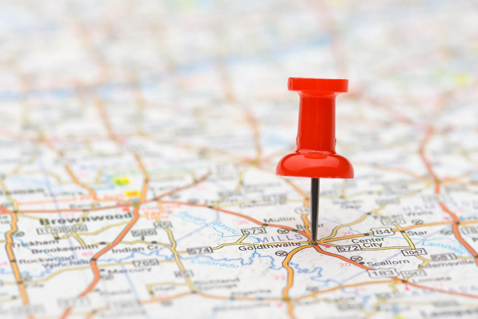 Red pushpin marking location on road map Find success in small markets with Google Ads for Therapists using strategic geographic targeting and lower competition advantages.