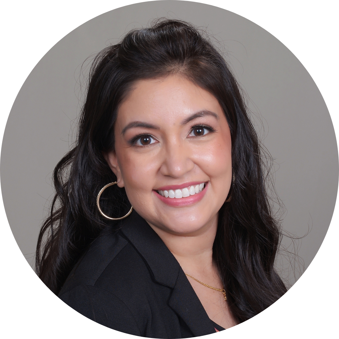 Portrait of a smiling Latina with long wavy brown hair and gold hoop earring