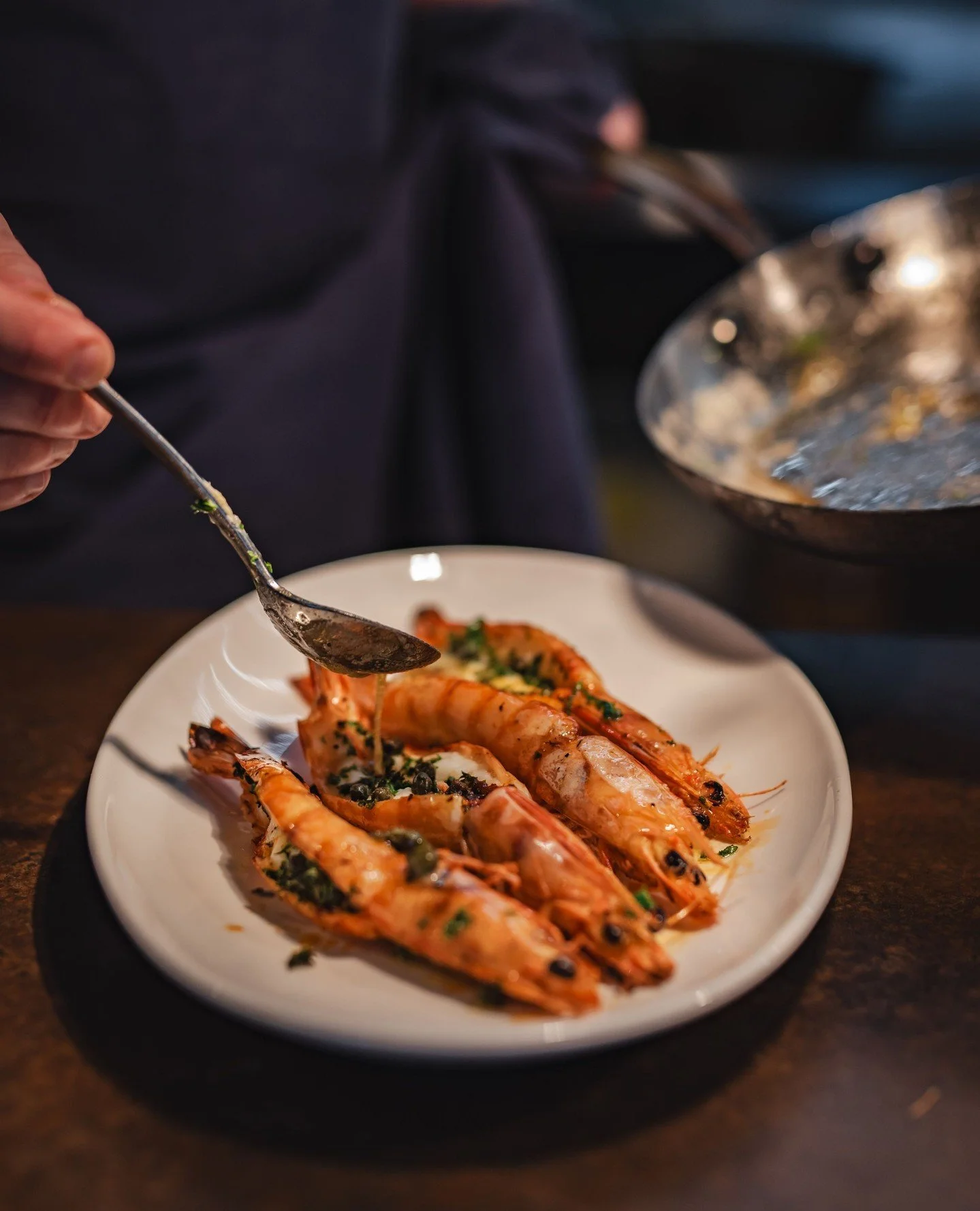Our most popular plate for a reason 🍤✨ Grilled Skull Island prawns with baby capers, chervil, and lemon beurre noisette - bold, buttery, and unforgettable.