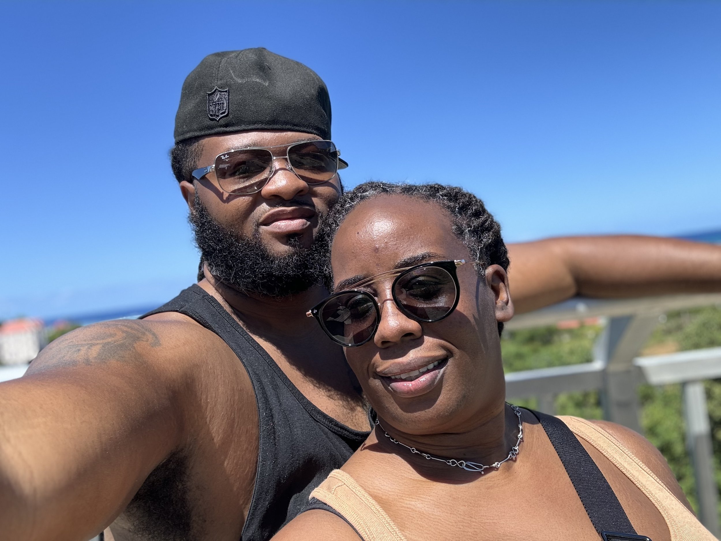 selfie image of Phil and Tamara Leonard wearing shades.