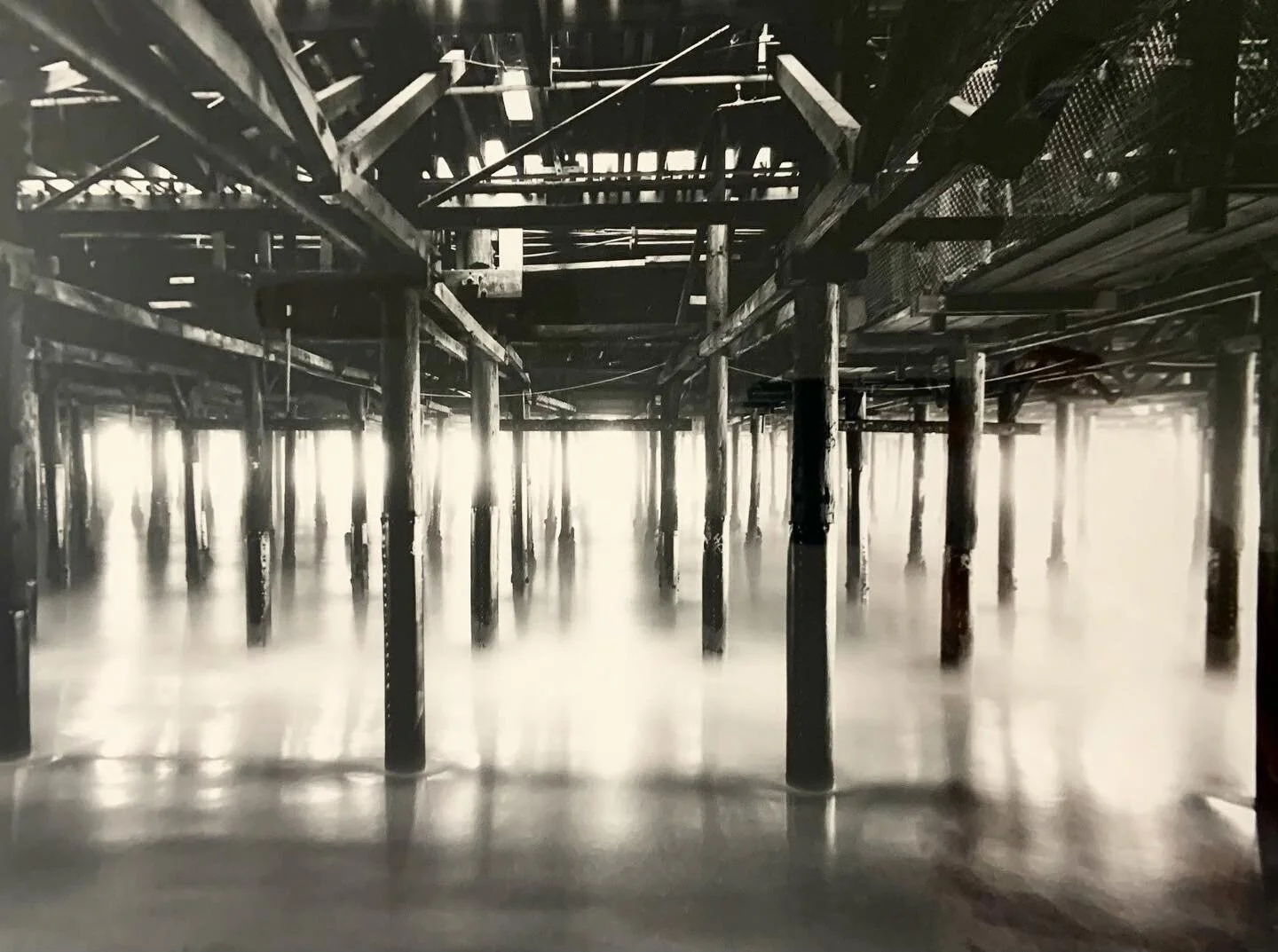 A dreamy scene underneath the pier☁️✨.