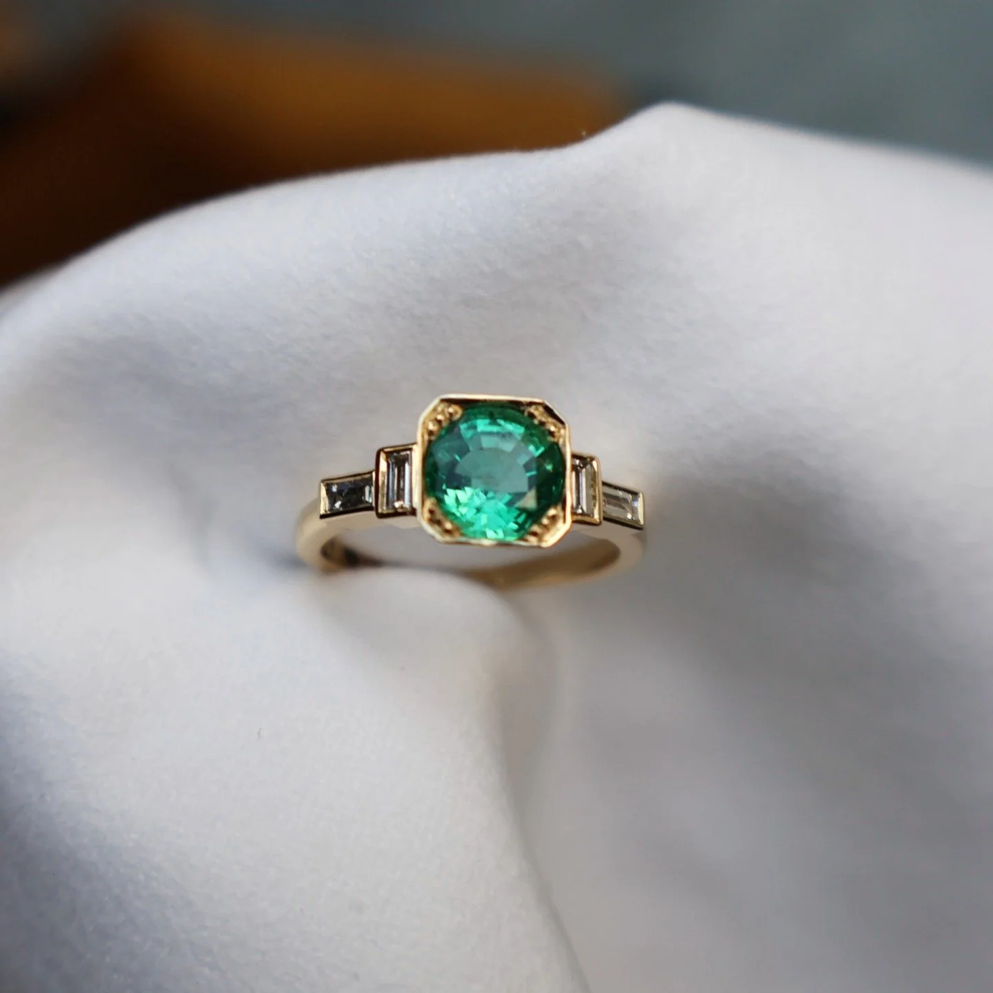 Bespoke | Heather &amp; Ben, congratulations on your engagement! 🥂

Heather had a round Colombian emerald she wanted set into an art deco style ring I made a few years ago, (last slide)

That particular ring has a square-shaped emerald center stone.