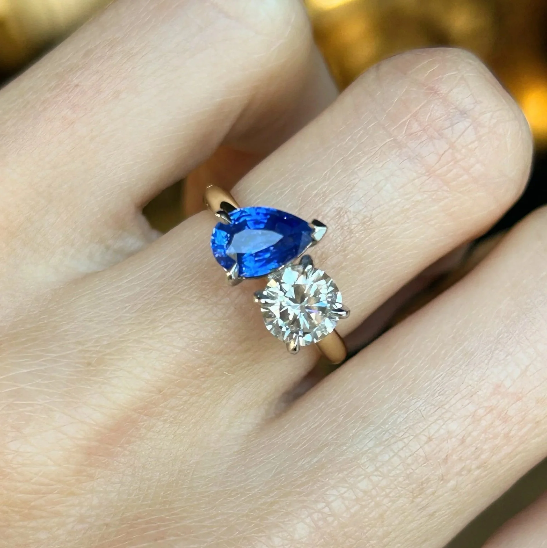 Blue sapphire and diamond two stone ring