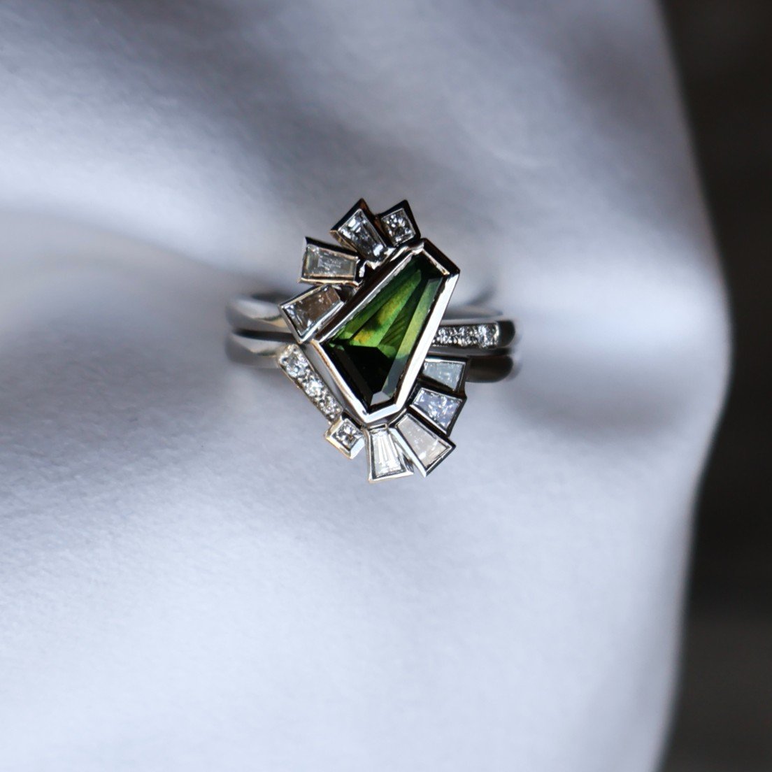 Bespoke | Liam &amp; Anna ✨

Here are a few more images of this one of a kind engagement and wedding ring set, designed and made for Liam &amp; Anna. 

Made in platinum, bezel set with a freeform Australian Sapphire and baguette and round shaped diam