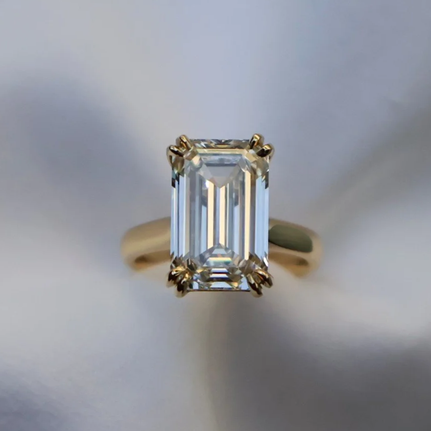 5ct emerald-cut lab diamond set into an 18ct yellow gold ring with double claws