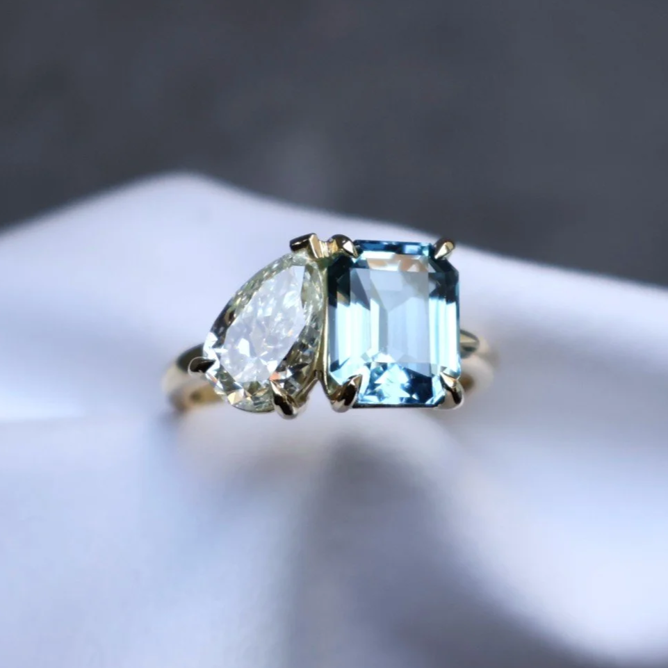 Natural pear diamond and emerald-cut aquamarine two stone diamond engagement ring madde on the Sunshine COast, QLD 