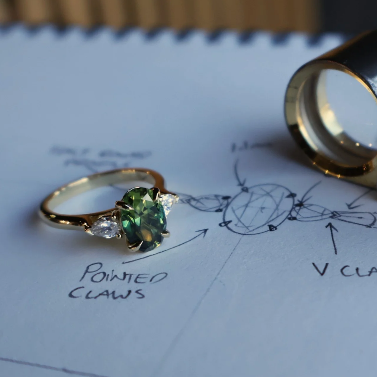 Oval sapphire light green and pear diamond three stone ring