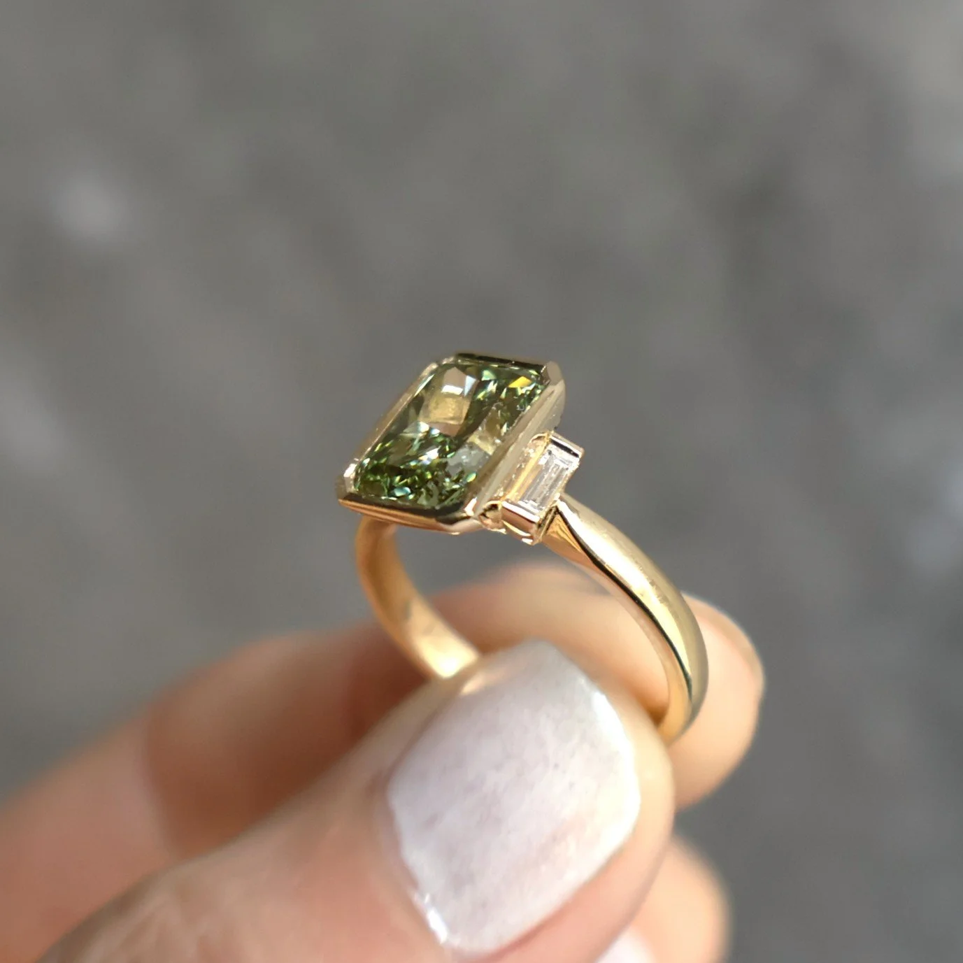 Green radiant lab diamond bezel baguette sides side view.JPG
