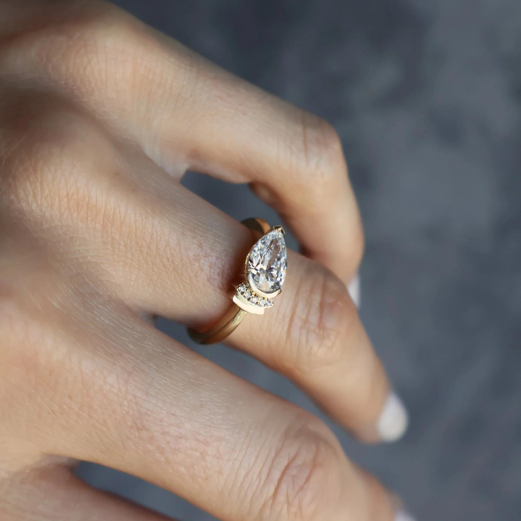 Pear diamond engagement ring that is traditional but still different