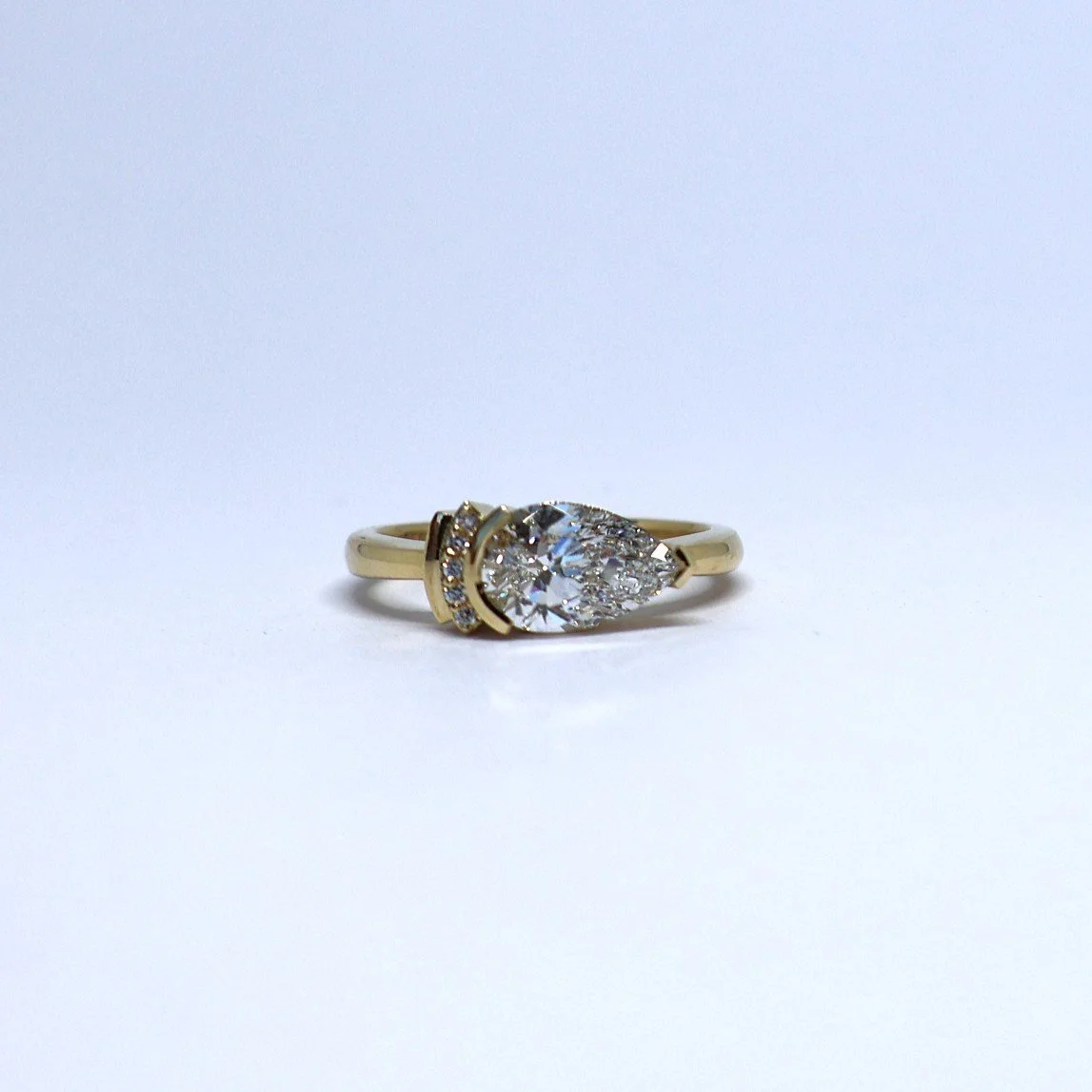 Art deco style ring set with a pear-shaped diamond, product image