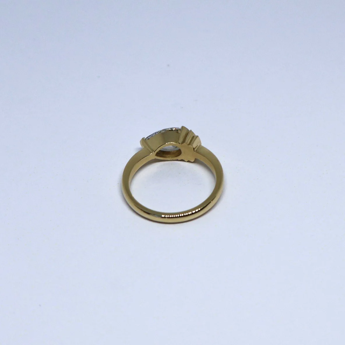 Art deco style ring set with a pear-shaped diamond, product image inside view