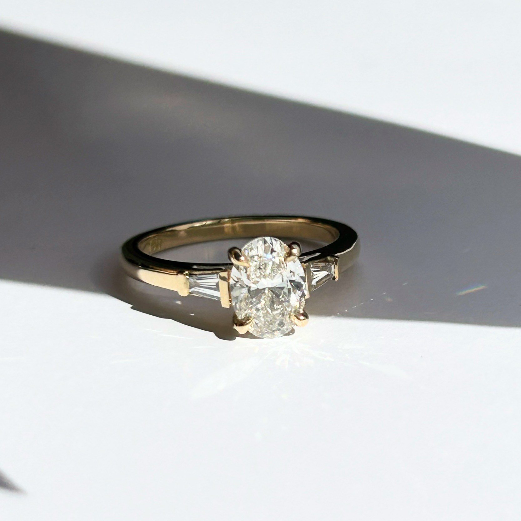 Product: Oval diamond three stone ring