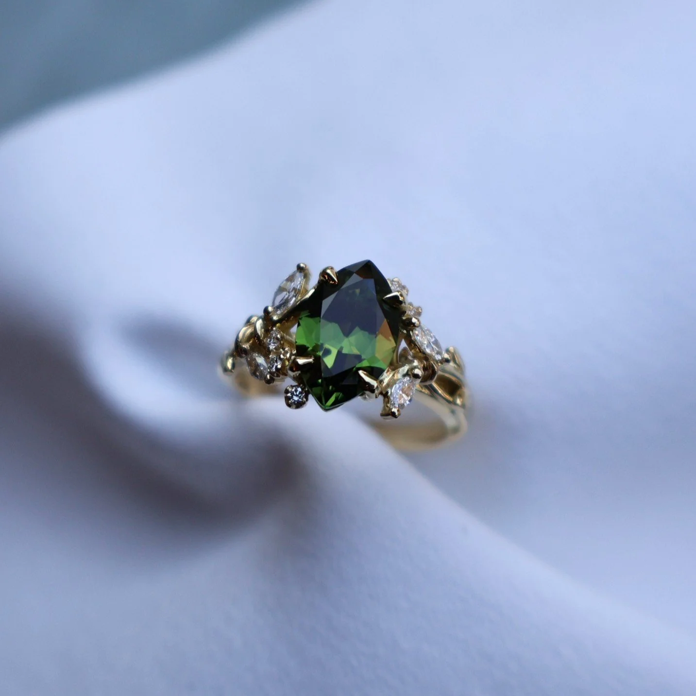 Green marquise sapphire nature inspired engagement ring