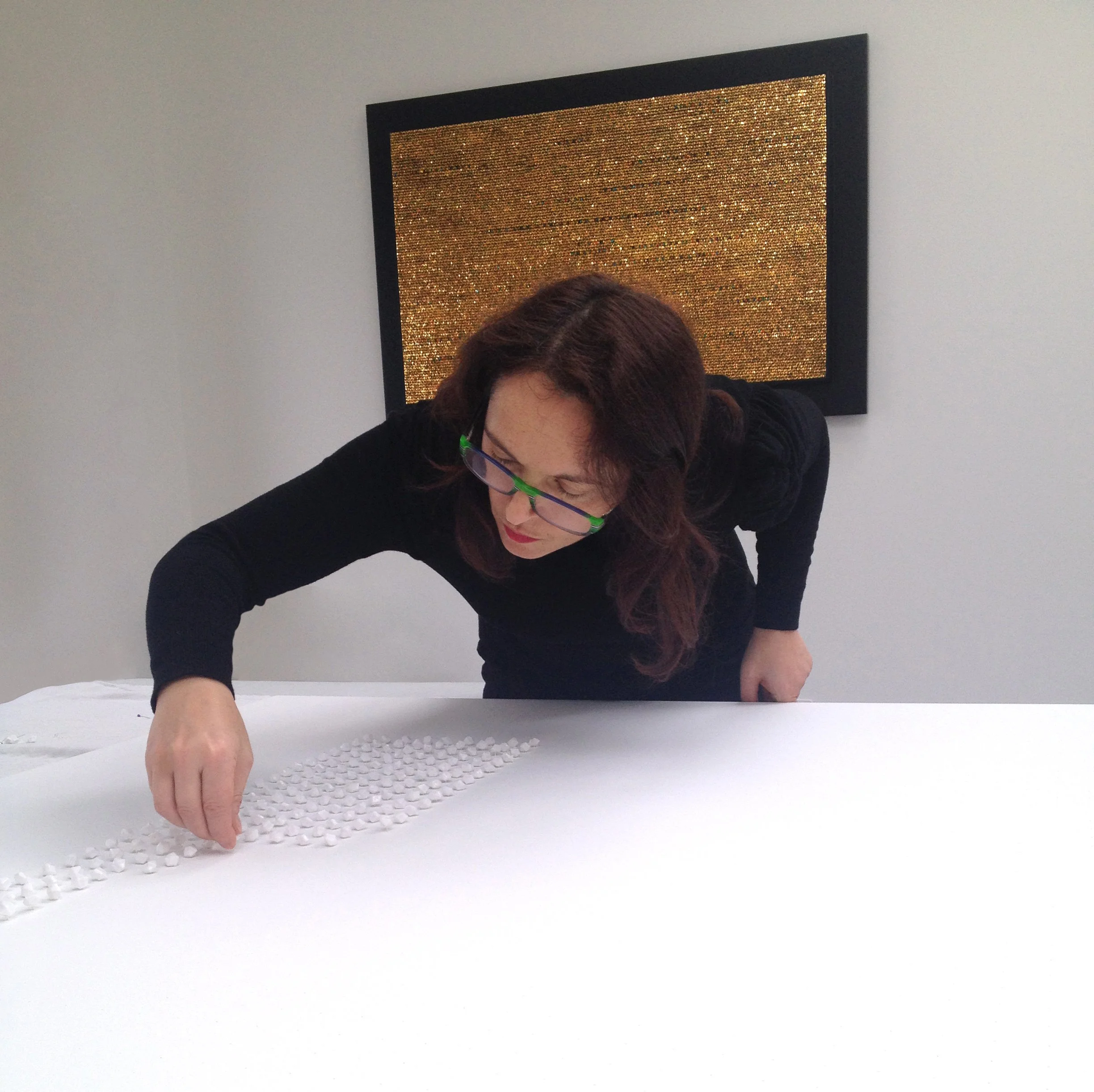 Mixed media mosaic artist Nathalie Vin working in her London studio - multi-faceted acrylic components on canvas